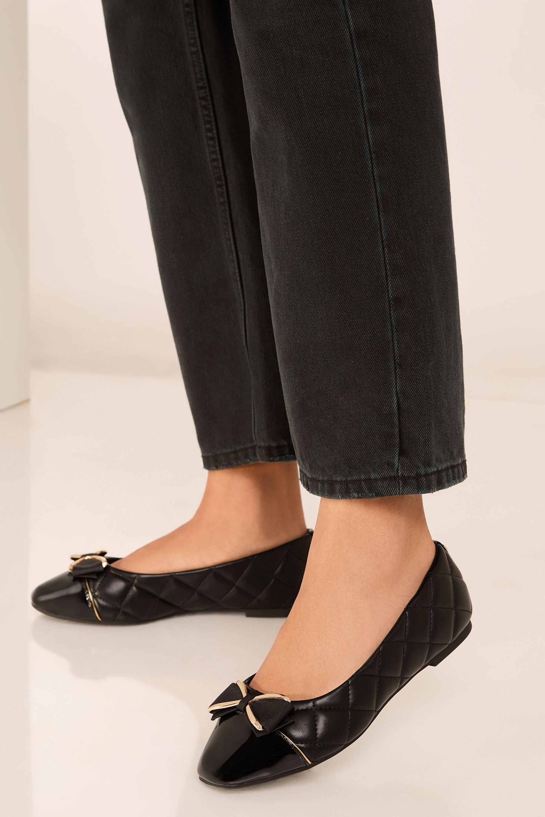 Buy Lipsy Black Wide Fit Flat Bow Trim Faux Leather Work Ballet Pump from the Next UK online shop