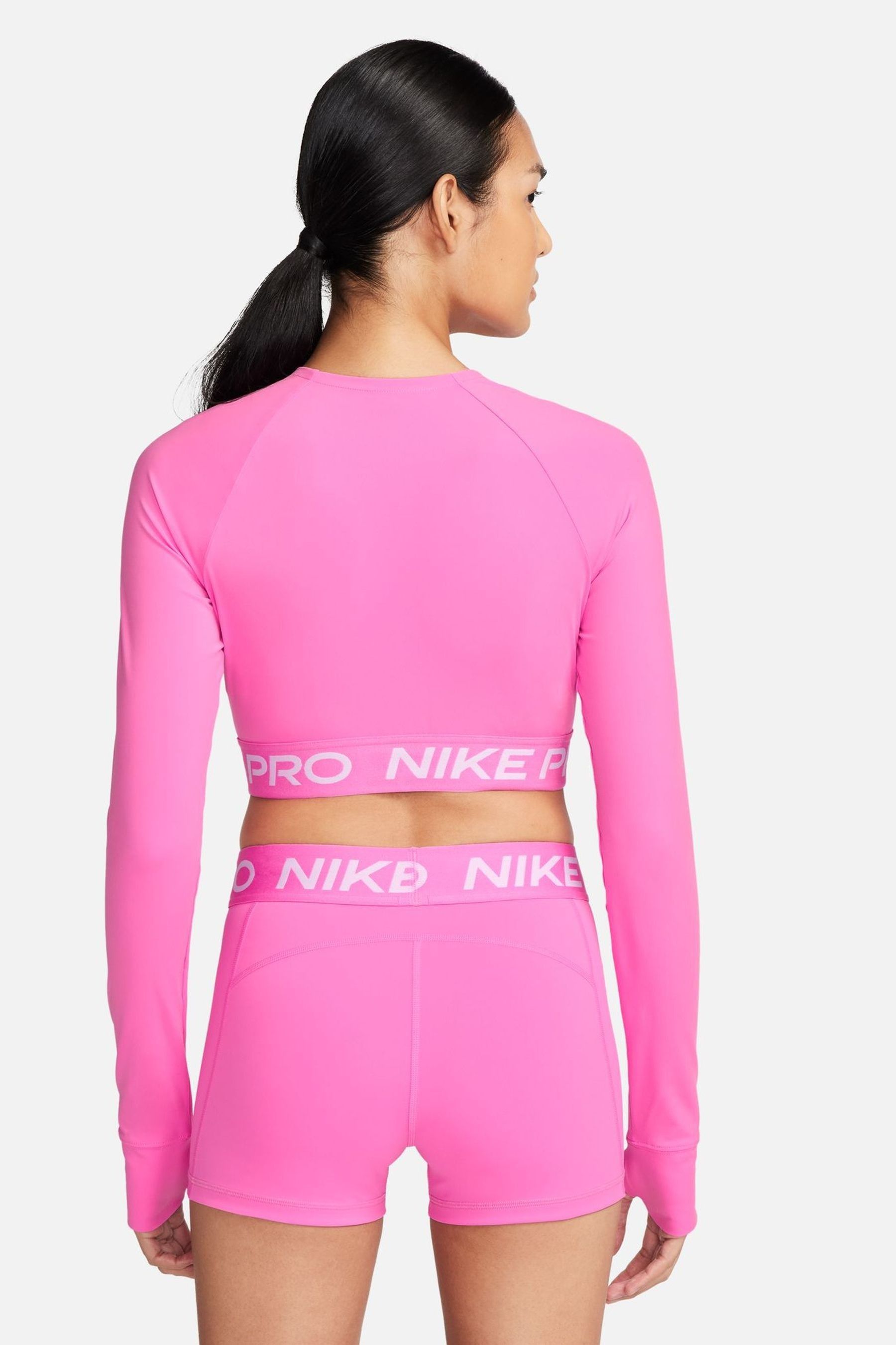Buy Nike Bright Pink Pro Dri FIT Cropped Long Sleeve Top from Next Luxembourg