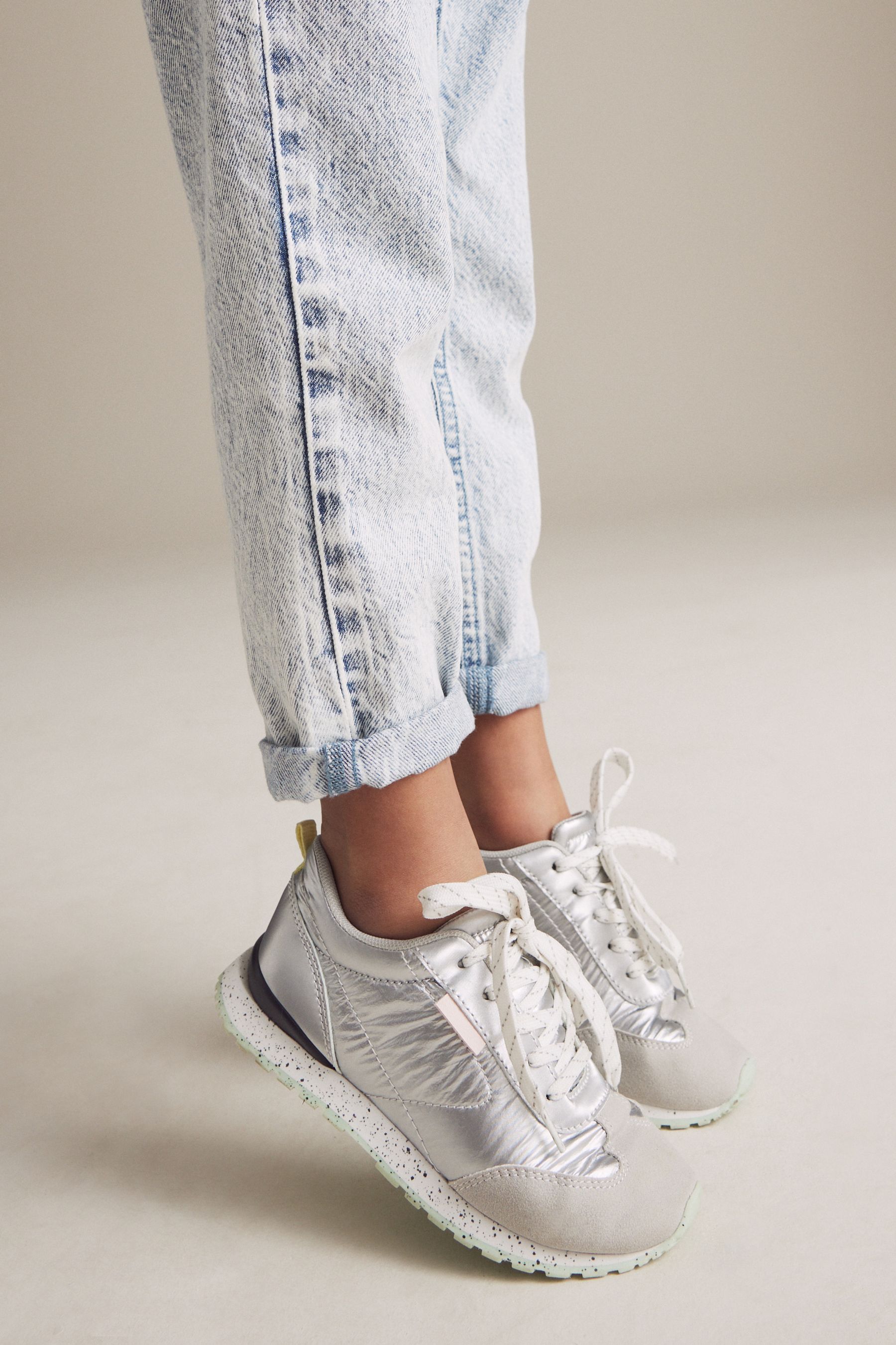 Silver metallic trainers top