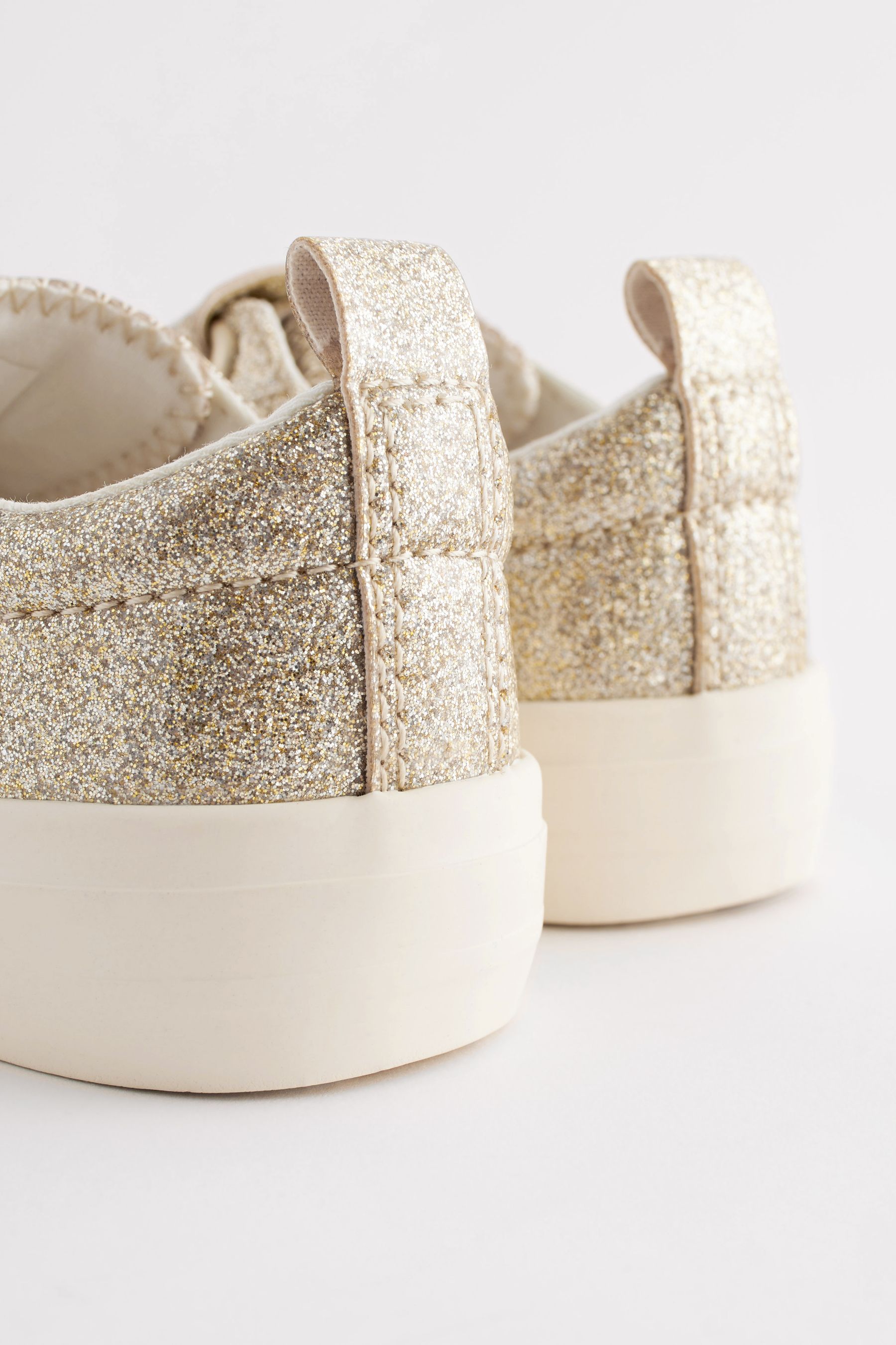 Sparkly gold trainers on sale