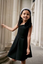 Black 3D Flower Corsage Asymmetric Scuba Occasion Dress (1.5-16yrs) - Image 1 of 6