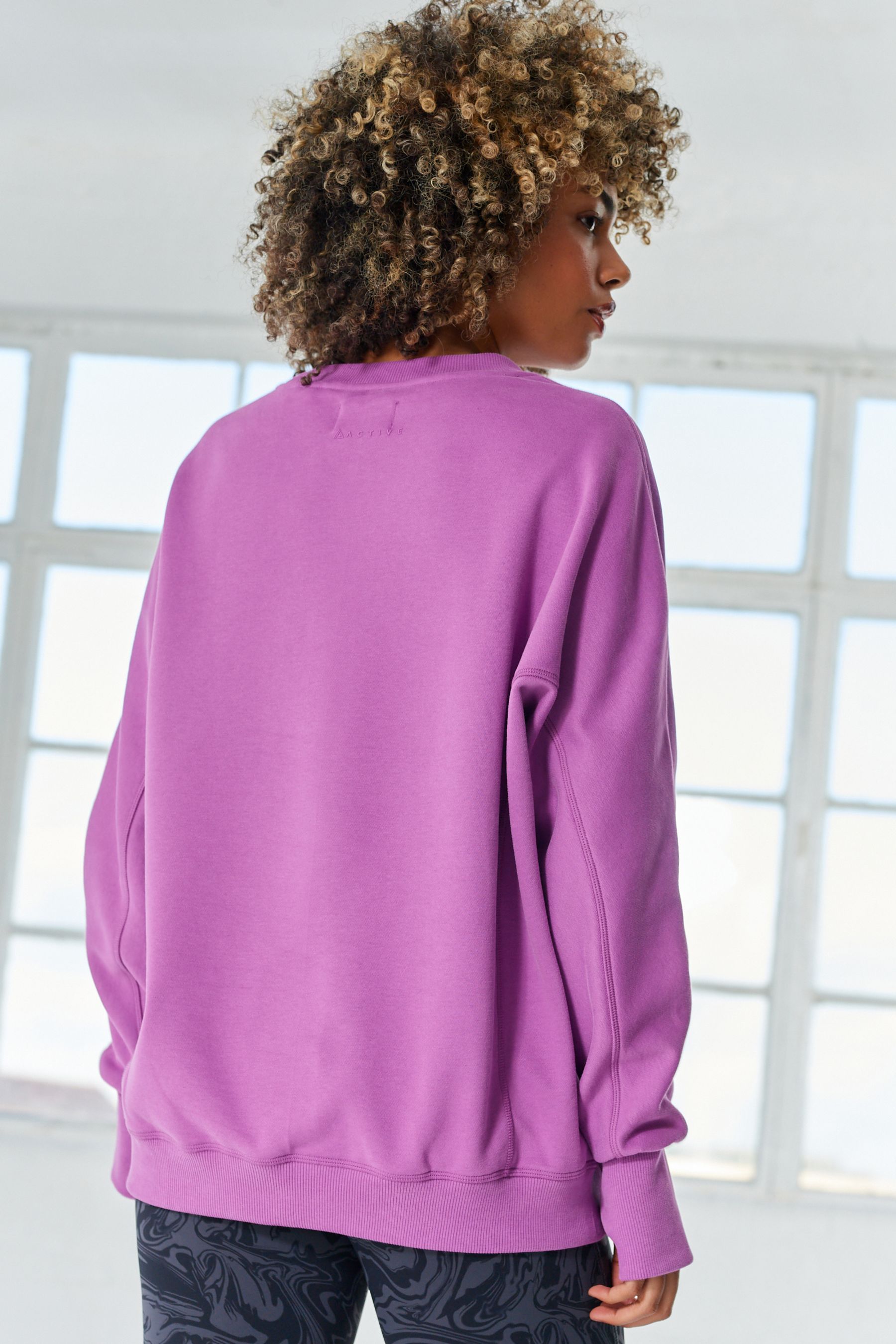 Buy Fluro Purple Active Sports Longline Crew Neck Sweatshirt from Next Oman
