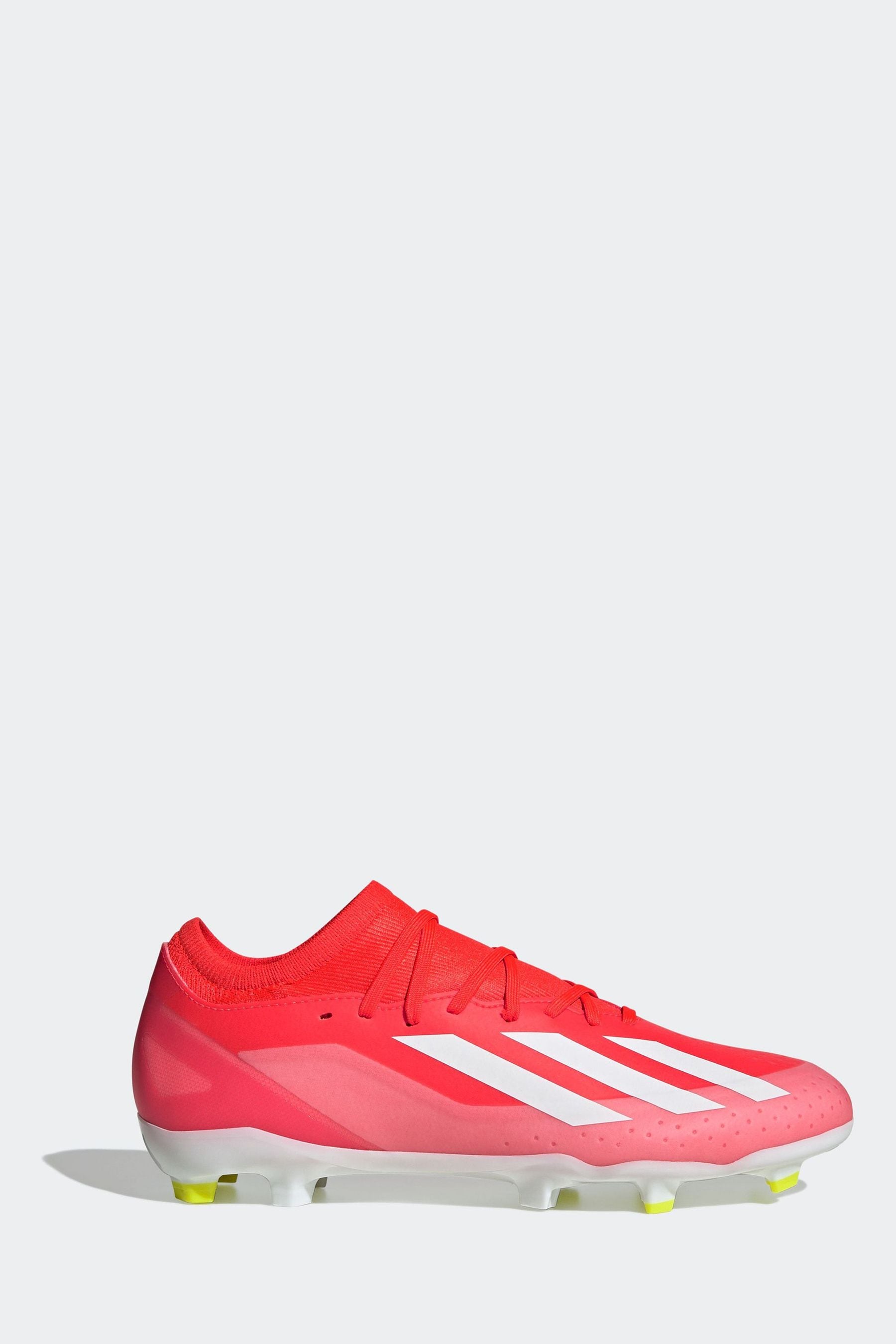 Red and white adidas football boots 2025