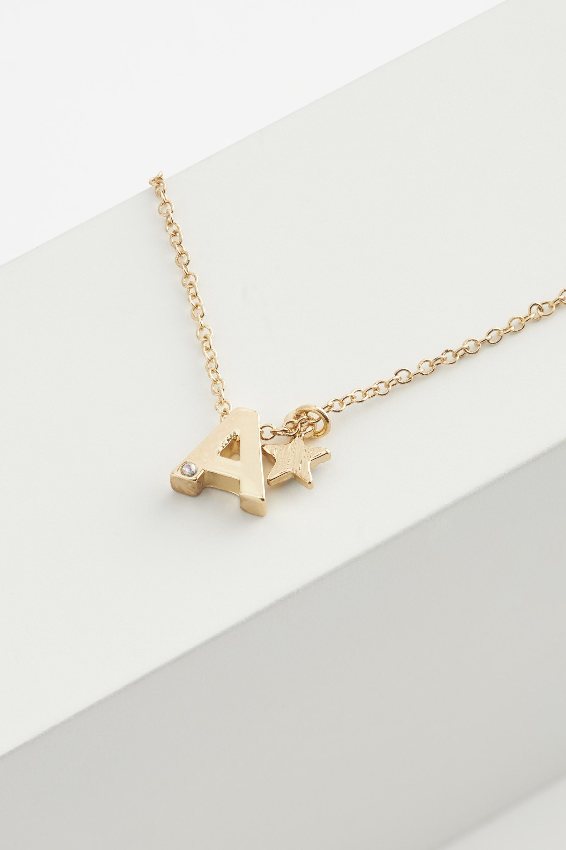 Next necklace initial top