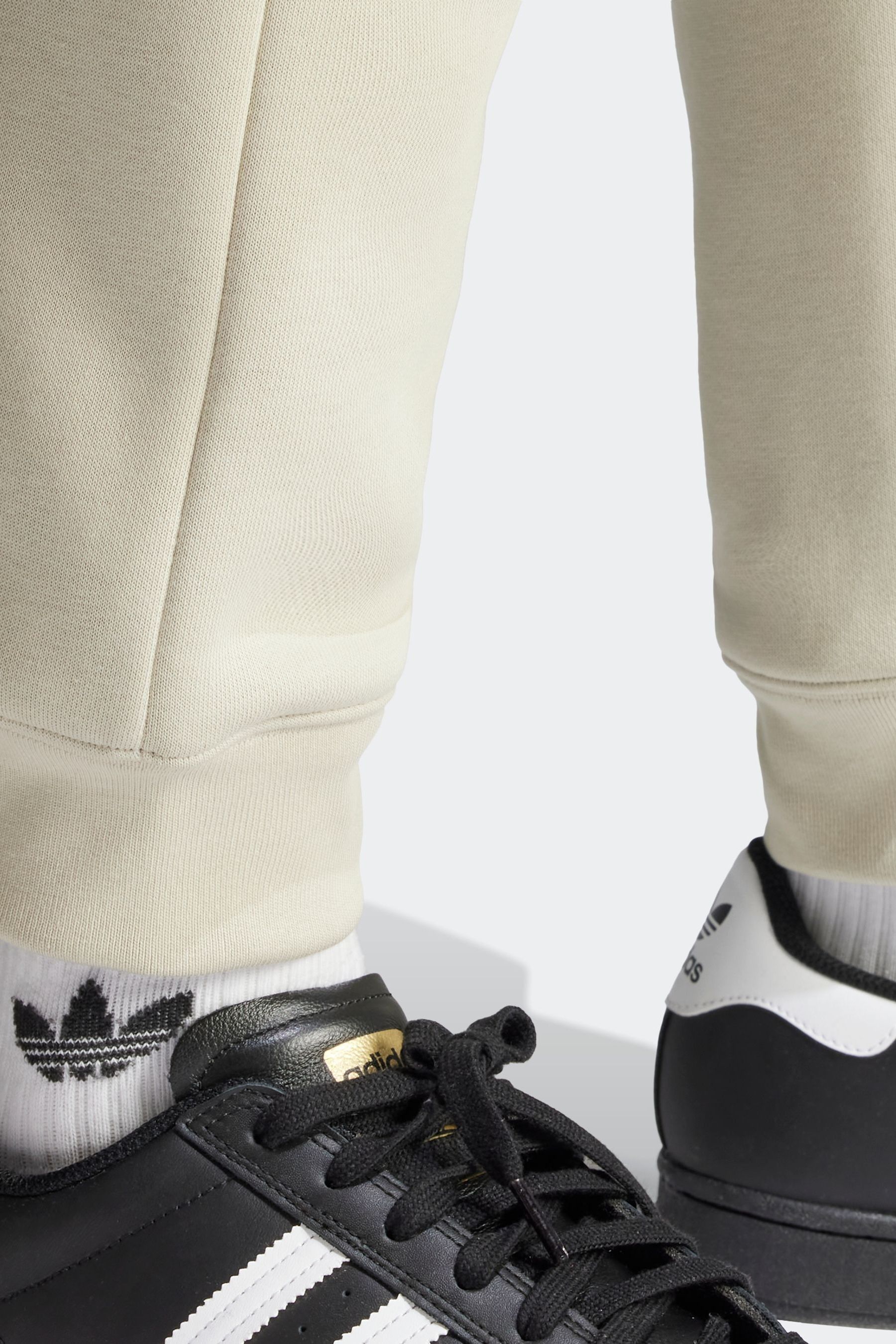Cream adidas joggers online