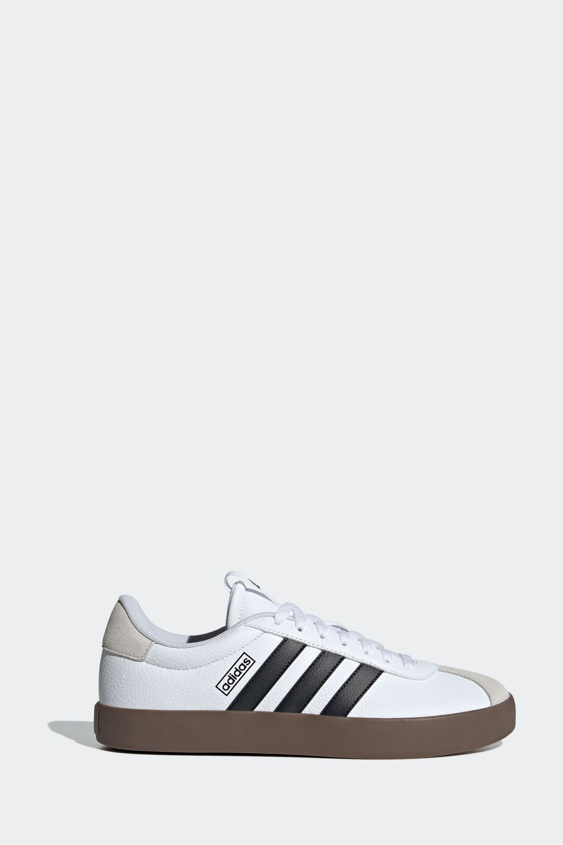 Adidas white trainers with black stripes best sale