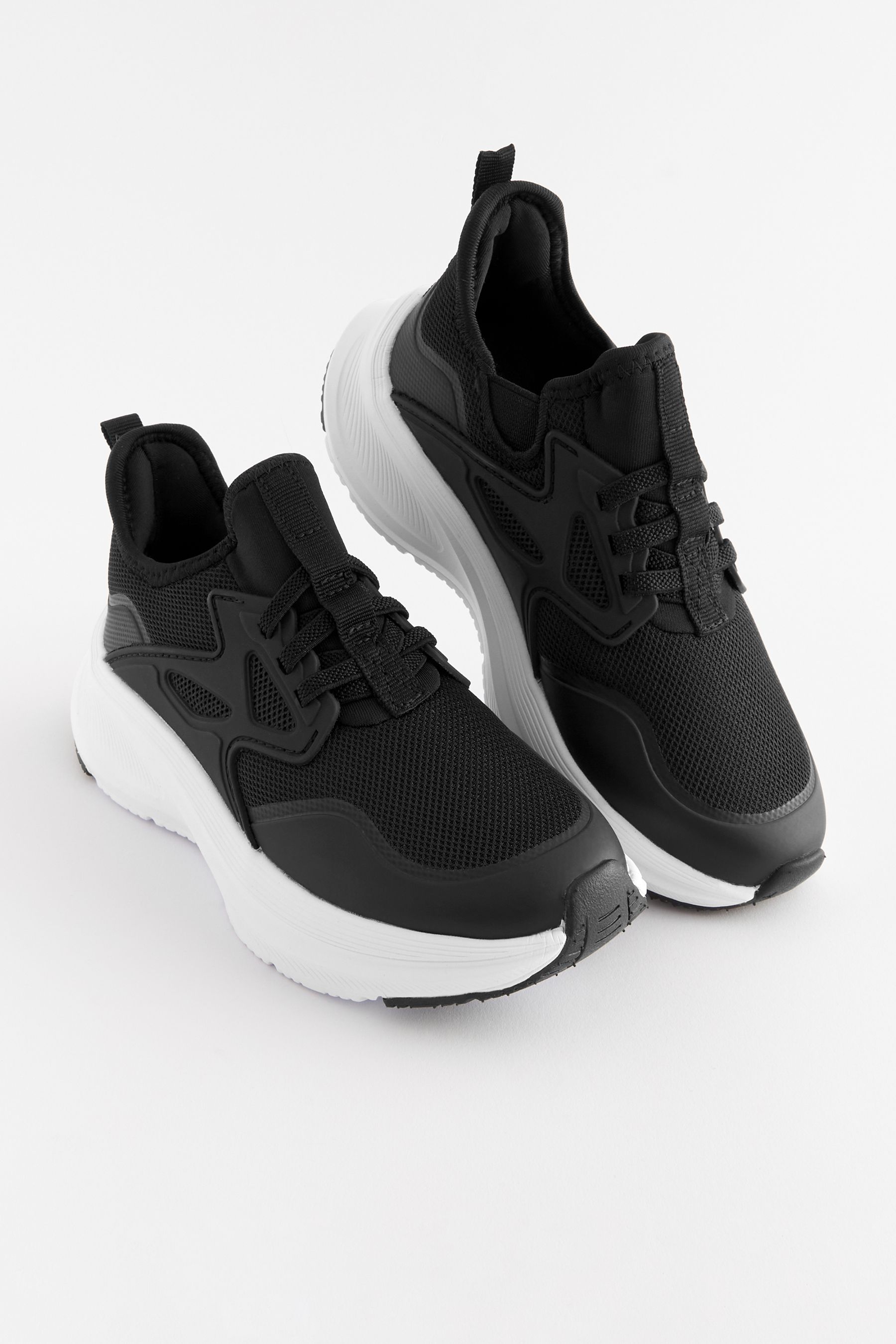 Black elastic trainers sales