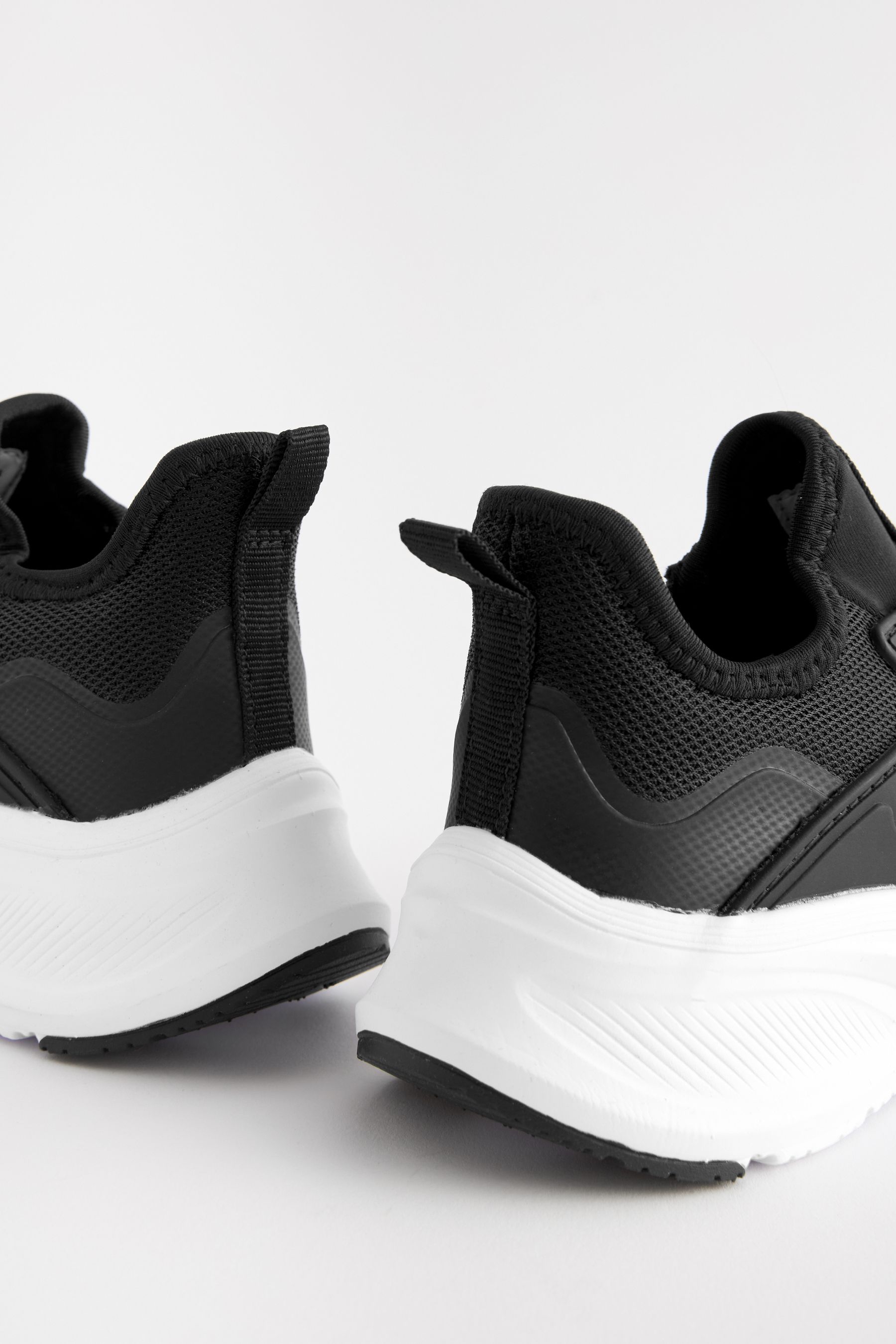 Black elastic trainers sales