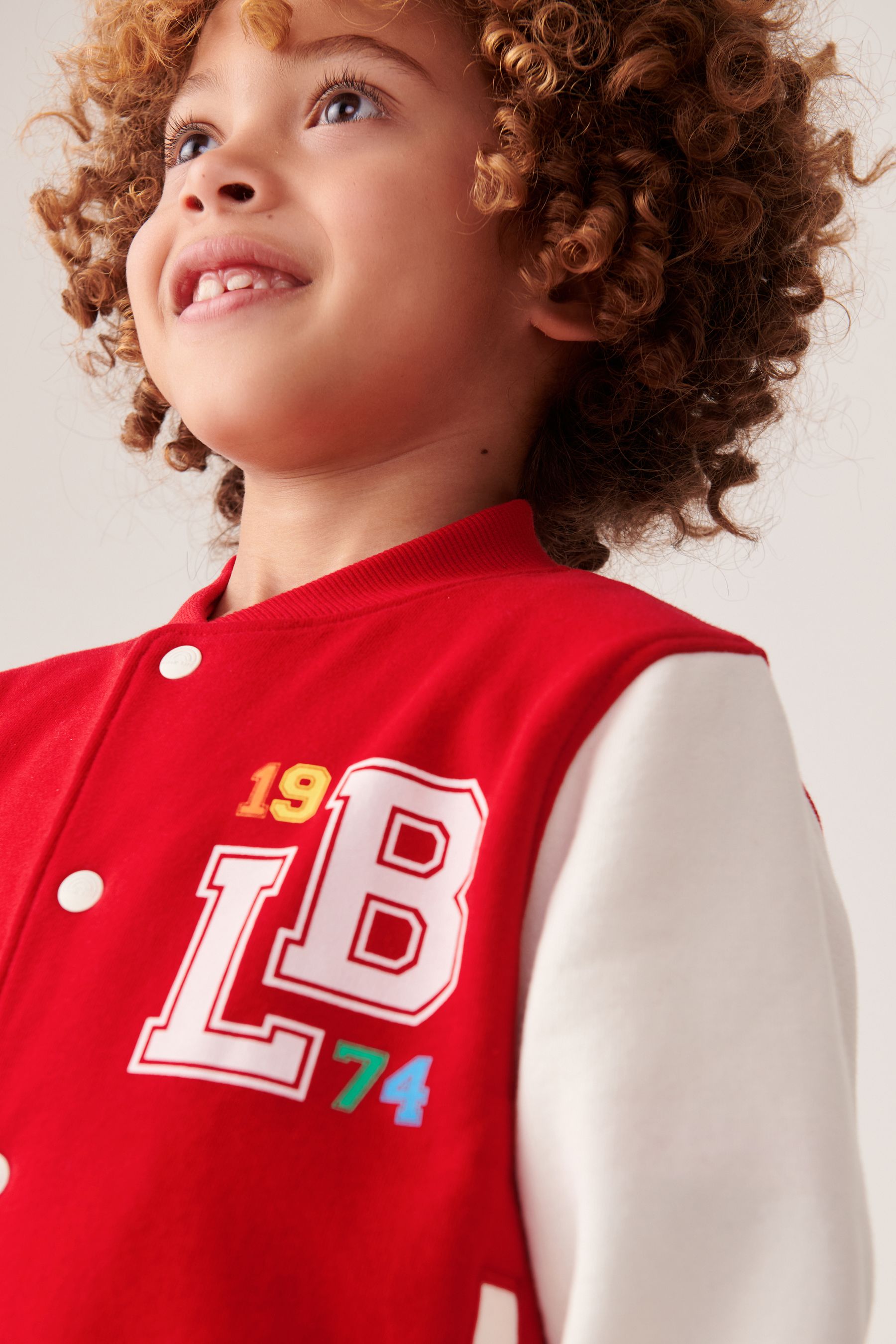 Rainbow varsity jacket sales