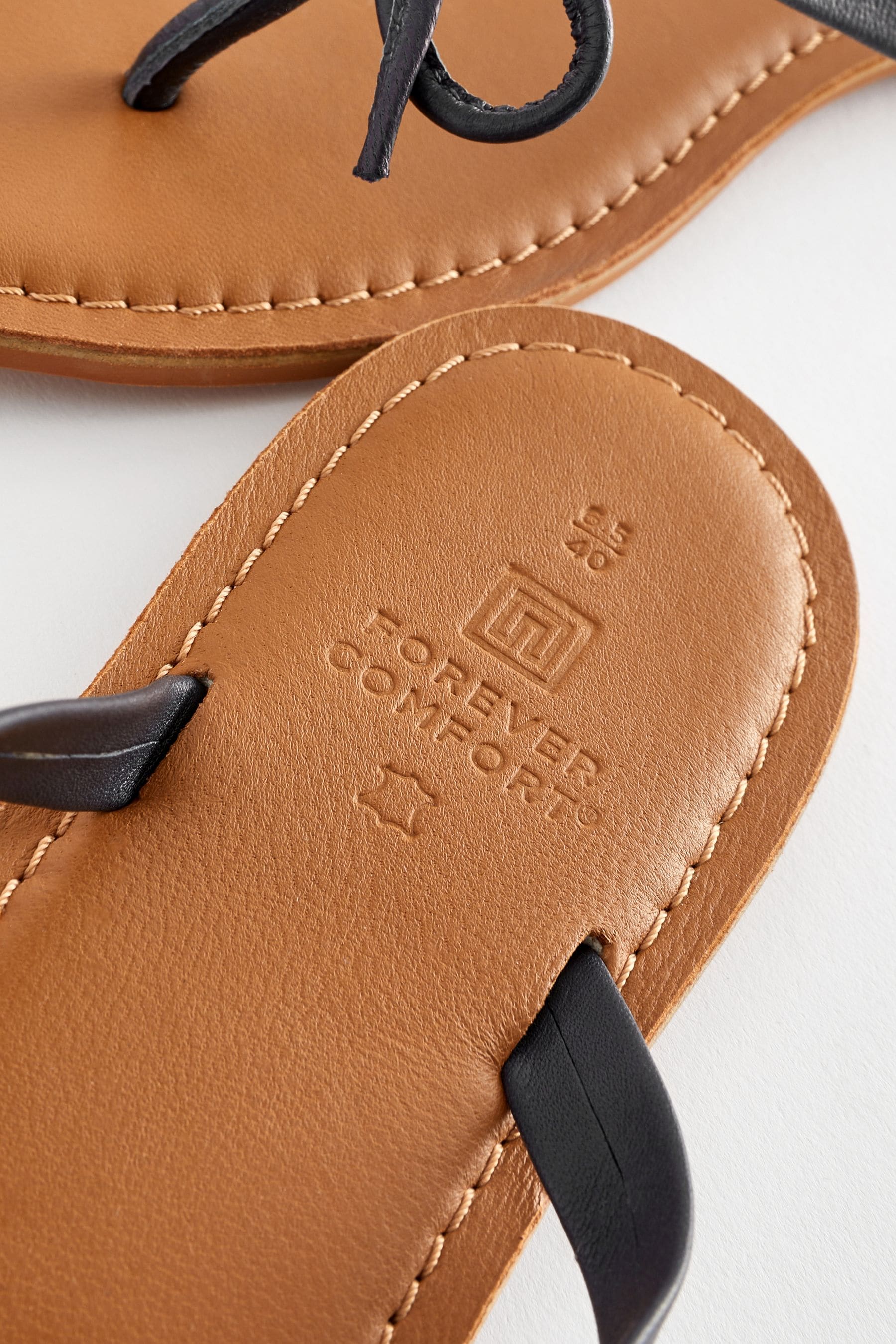 Buy Navy Blue Standard Wide Fit Forever Comfort Bow Detail Leather Flip Flops from the Next UK online shop