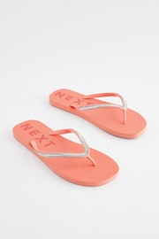 Coral Pink Jewelled Beach Flip Flops - Image 1 of 5