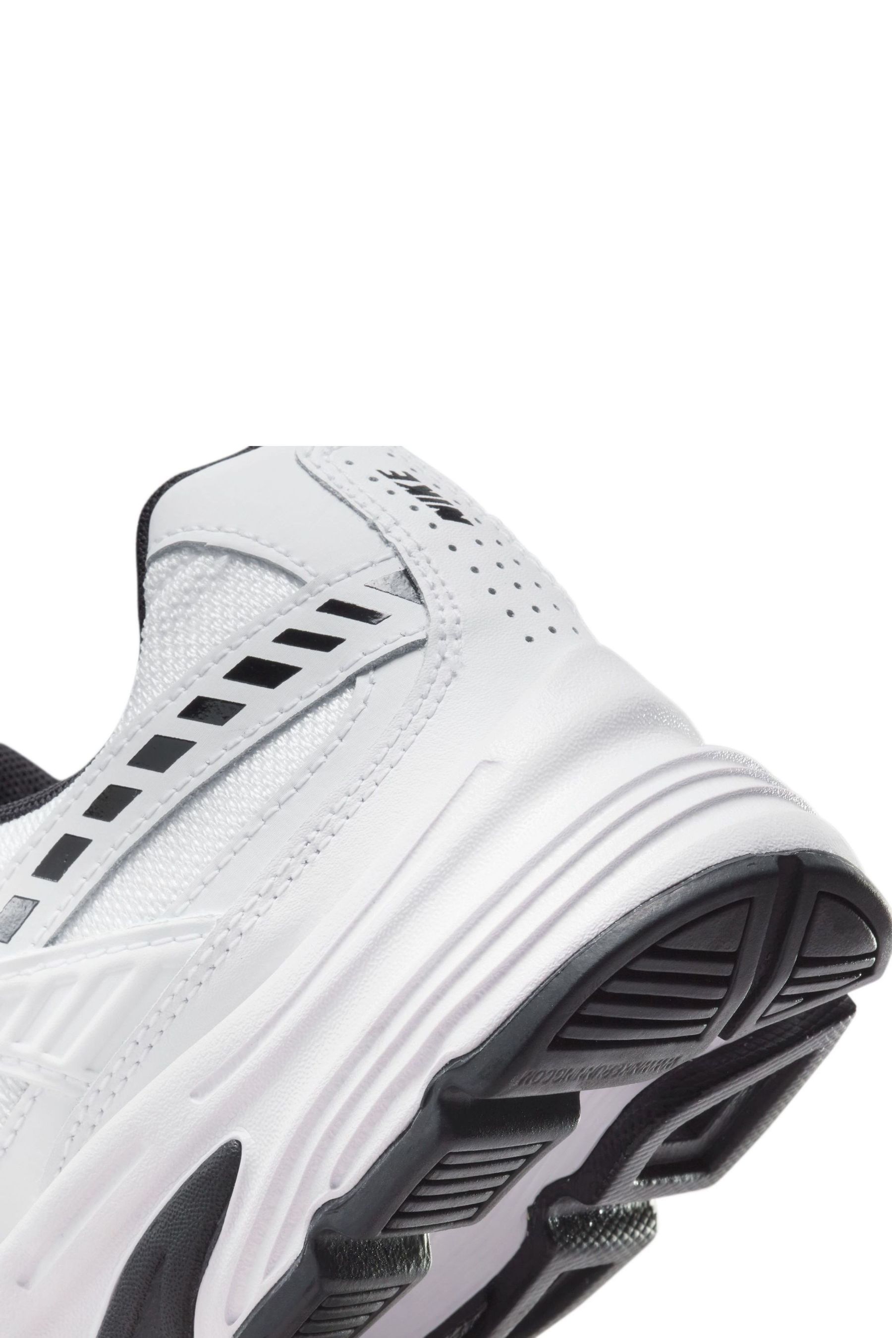 Nike white shoes with black logo on sale