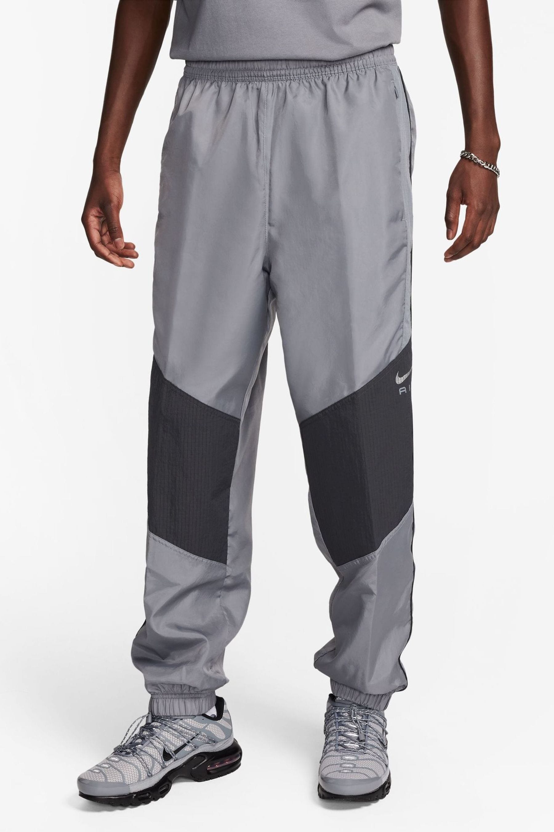 Buy Nike Black Grey Sportswear Air Woven Joggers from the Next UK online shop