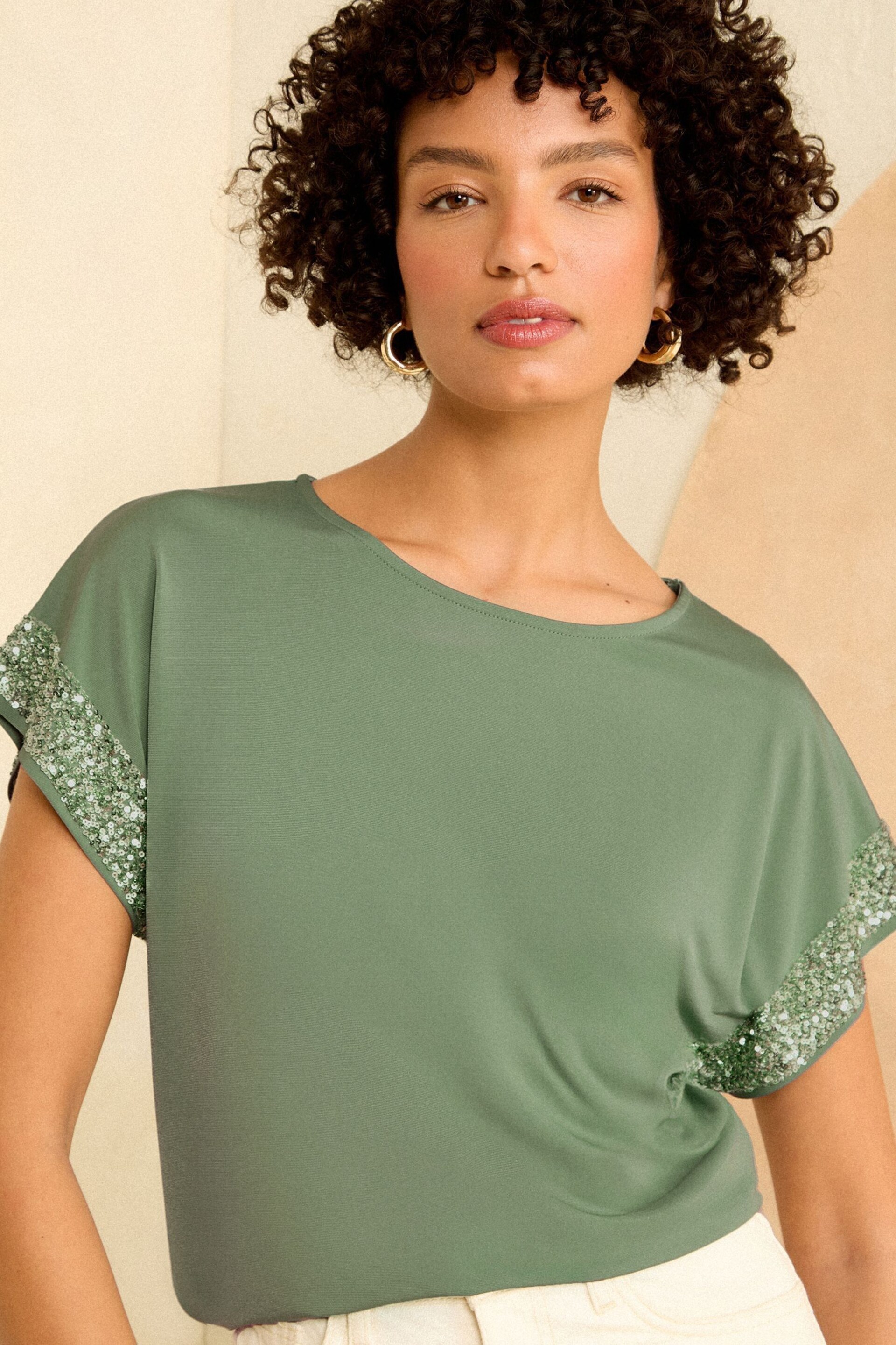 Love & Roses Green Sequin Cuff Jersey Top - Image 1 of 4