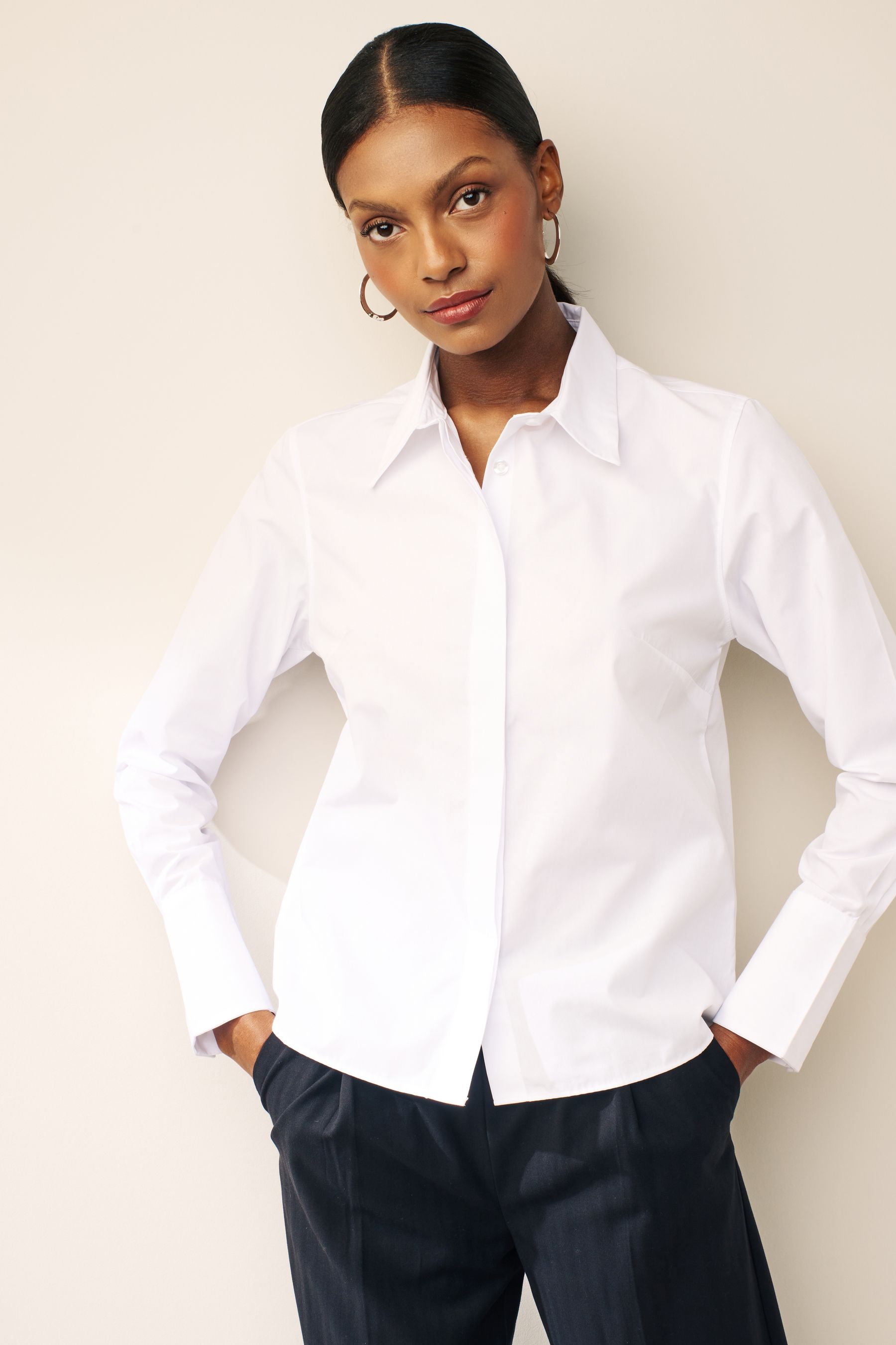 Fitted white long sleeve shirt top
