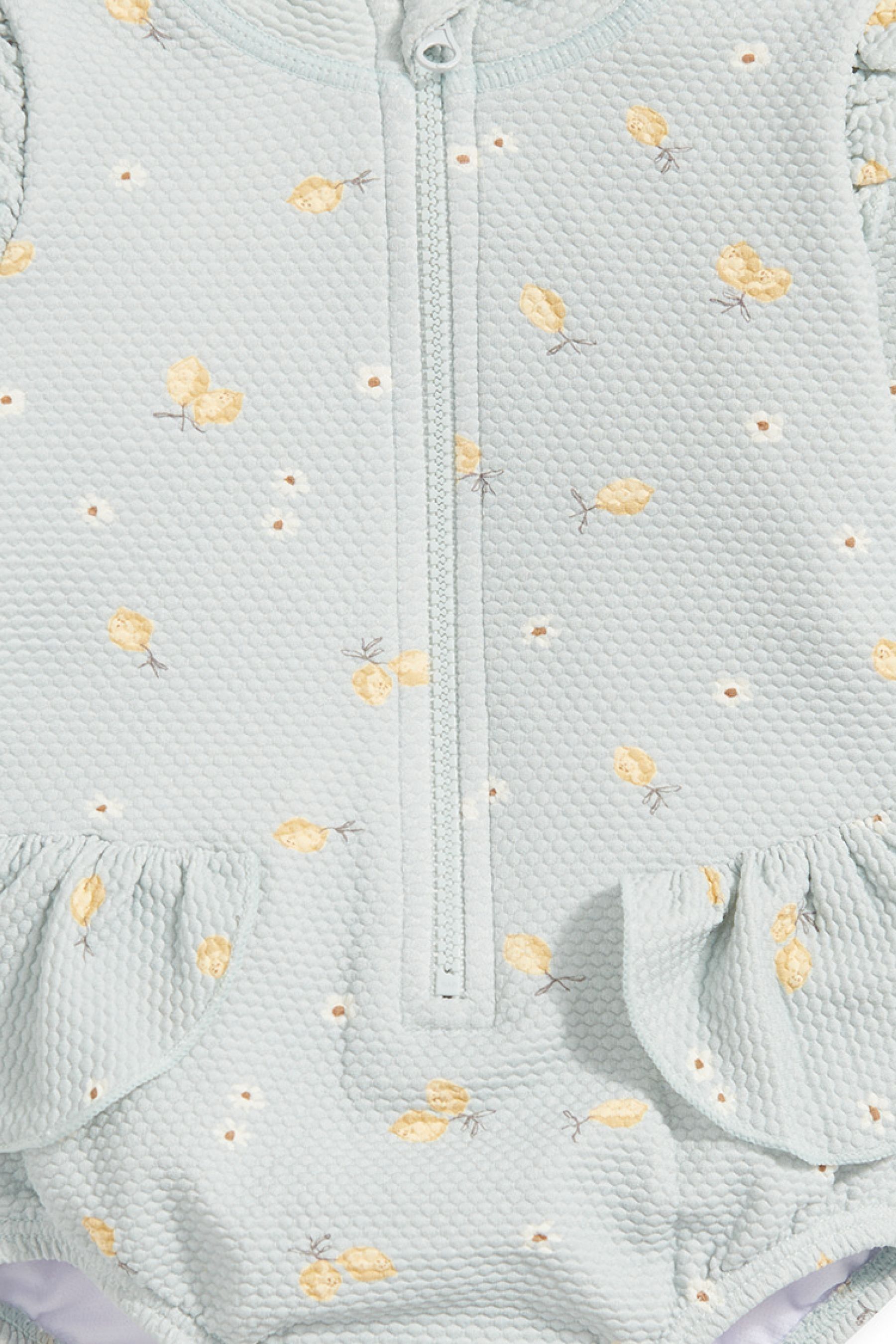 Buy Mamas Papas Blue Lemon Print Textured Long Sleeve Frill Swimsuit from Next Luxembourg