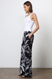 Religion Black Wide Leg Trousers in Botanic Print in Crepe - Image 6 of 7