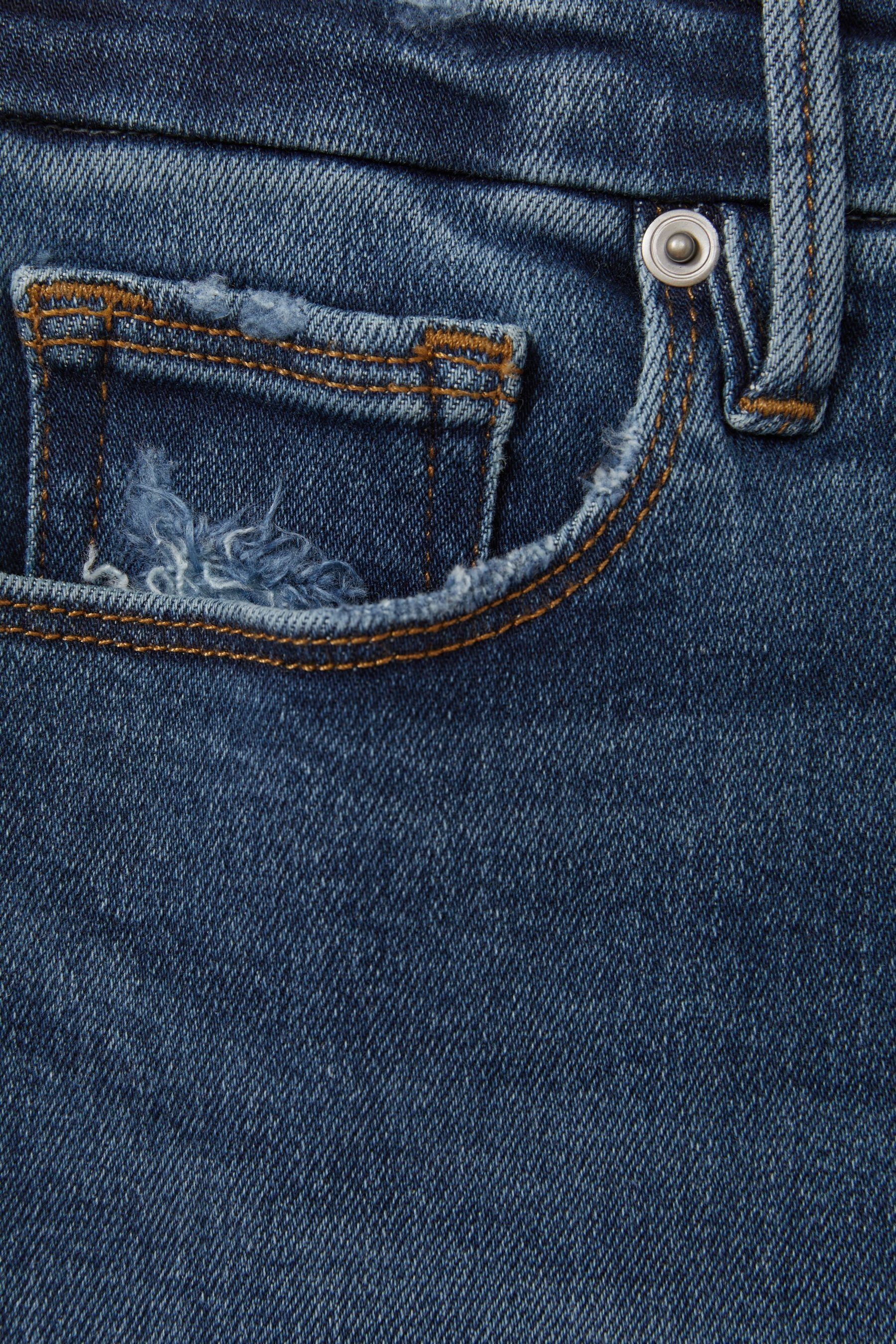 Buy Good American Indigo Good American Mid Rise Raw Hem Skinny Jeans from the Next UK online shop