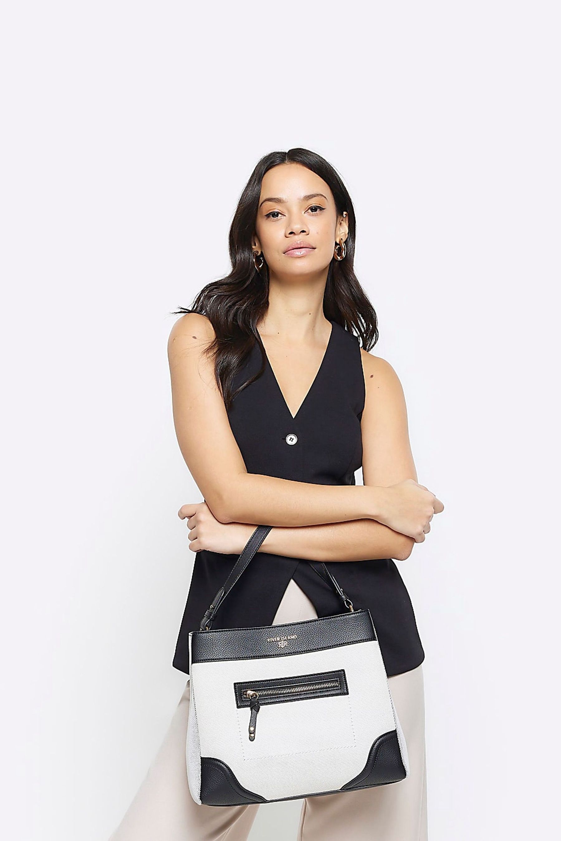 River island black pocket front slouch bag store