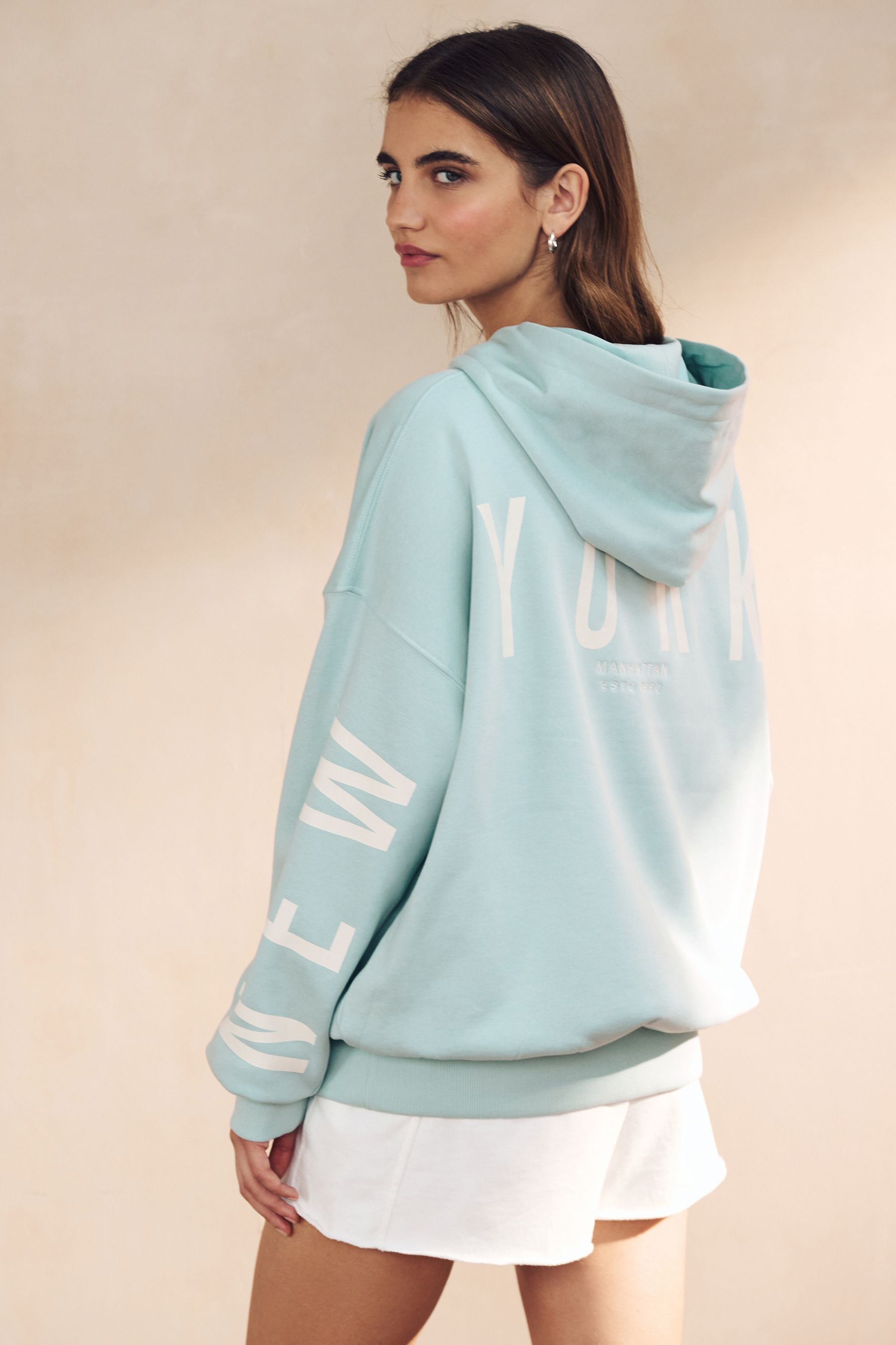 Buy Baby Blue Oversized Relaxed Fit Back Graphic Slogan Longline Hoodie from the Next UK online shop
