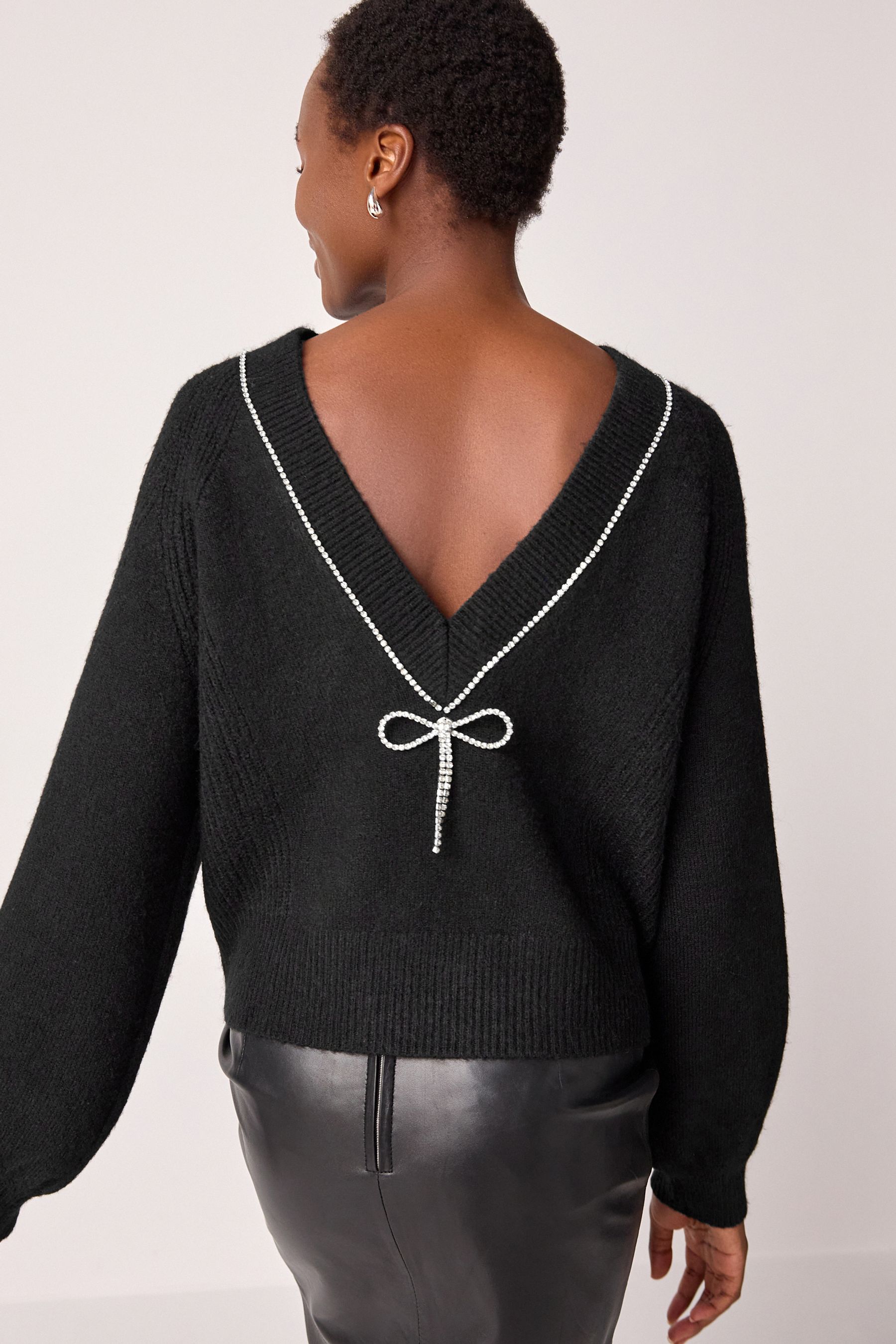 Black sweater with bow on shoulder clearance