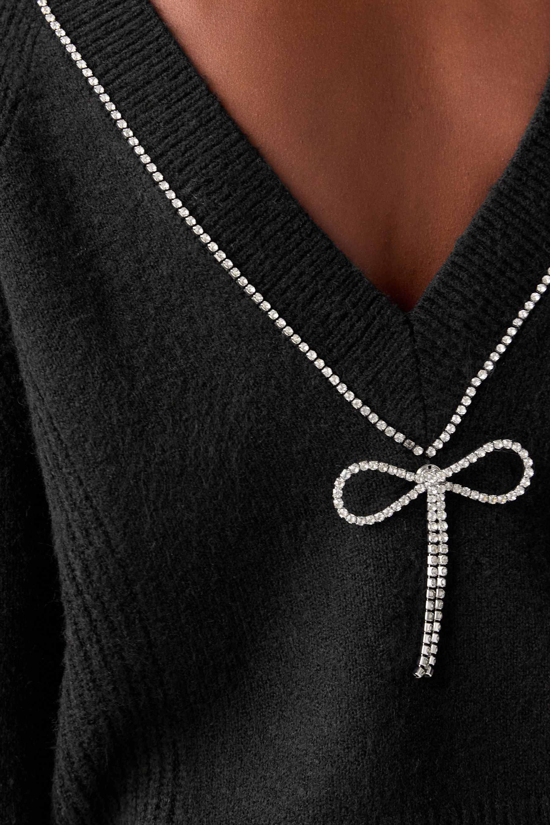 Black jumper with silver bow online
