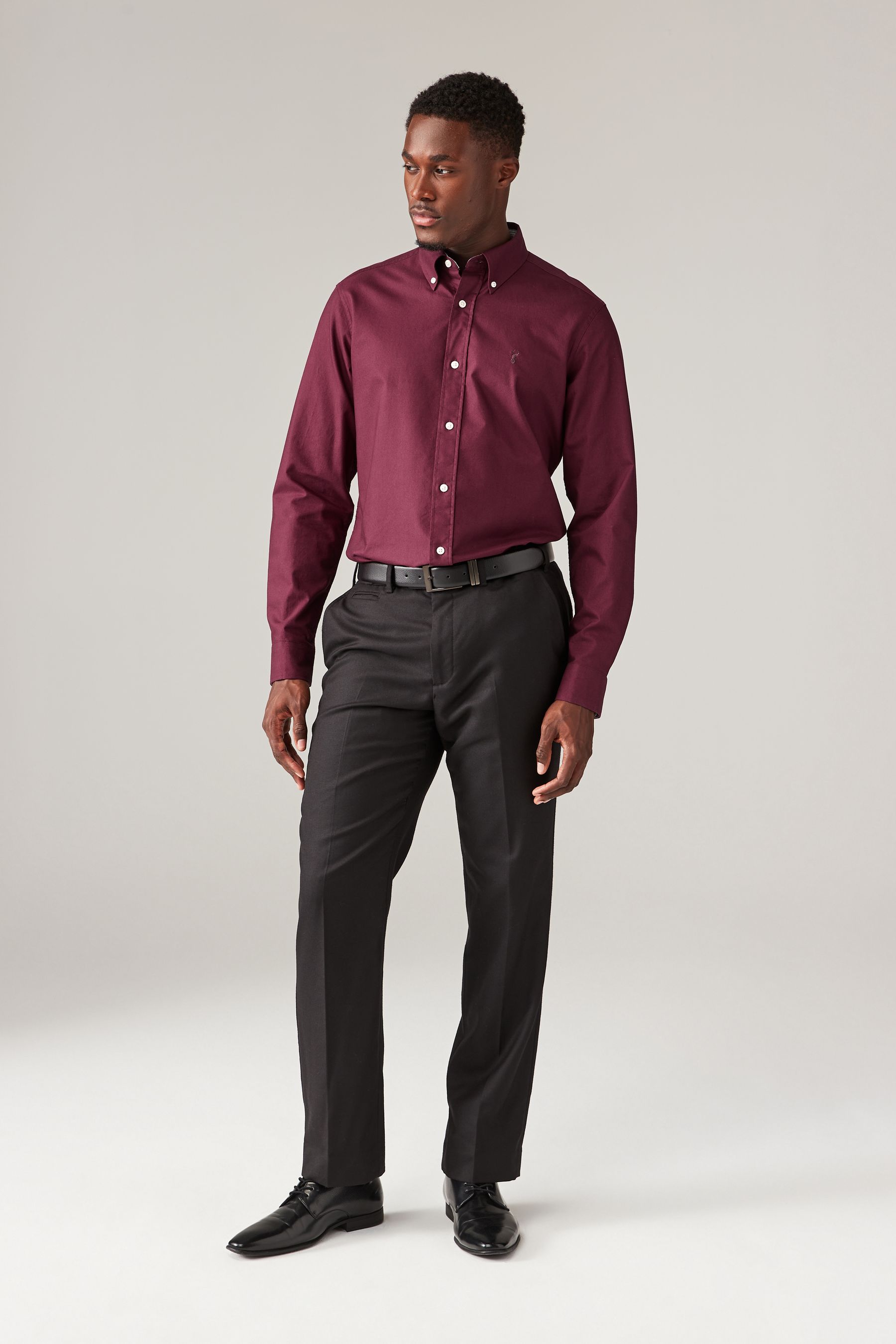 Burgundy shirt and grey pants shop