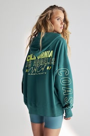 Teal Blue Green Relaxed Fit Oversized California Back Graphic Slogan Longline Hoodie - Image 4 of 9