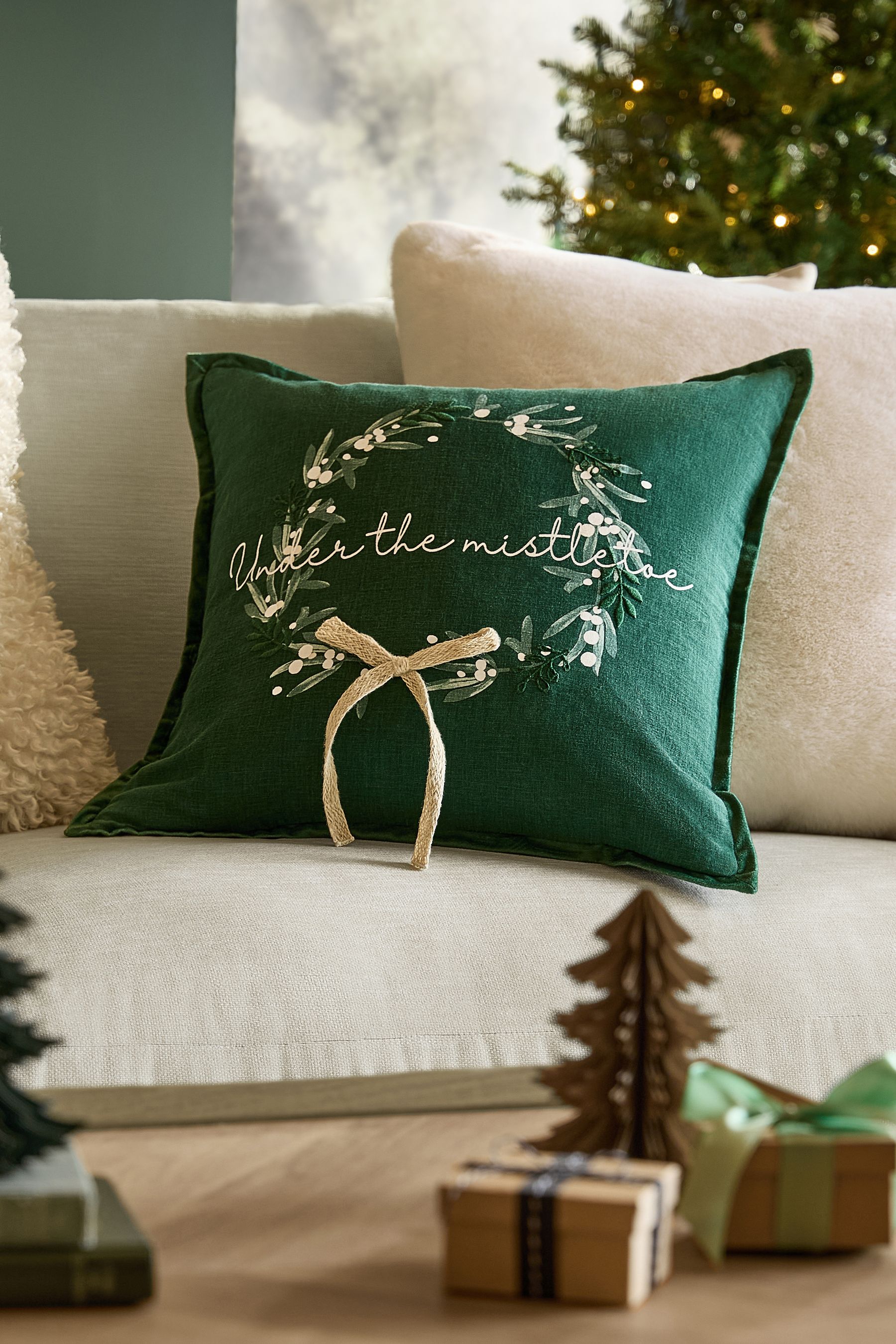 Buy Green Under the Mistletoe Christmas Cushion from Next Ireland