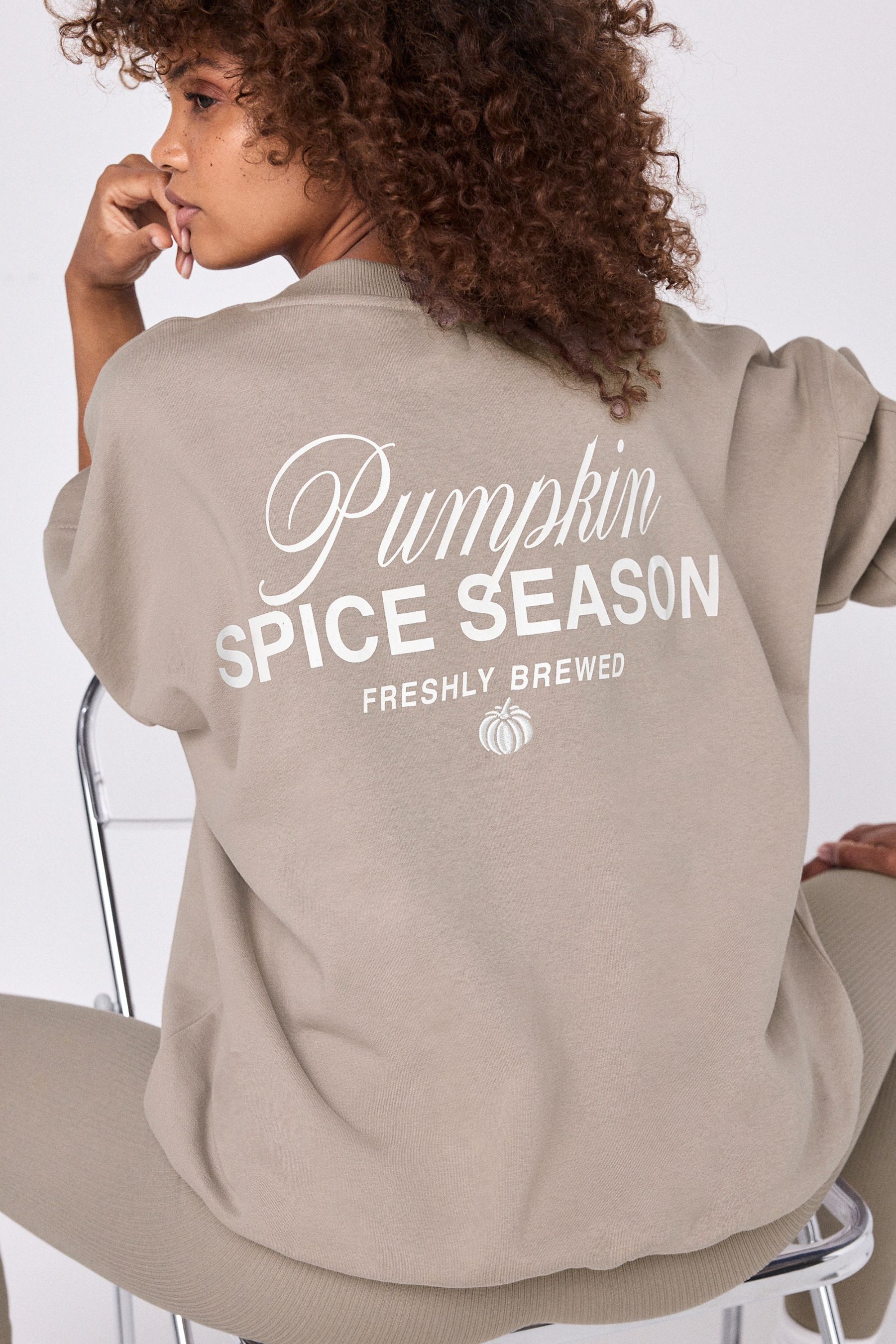 Buy Neutral Relaxed Fit Pumpkin Spice Latte Back Graphic Slogan Sweatshirt from the Next UK online shop
