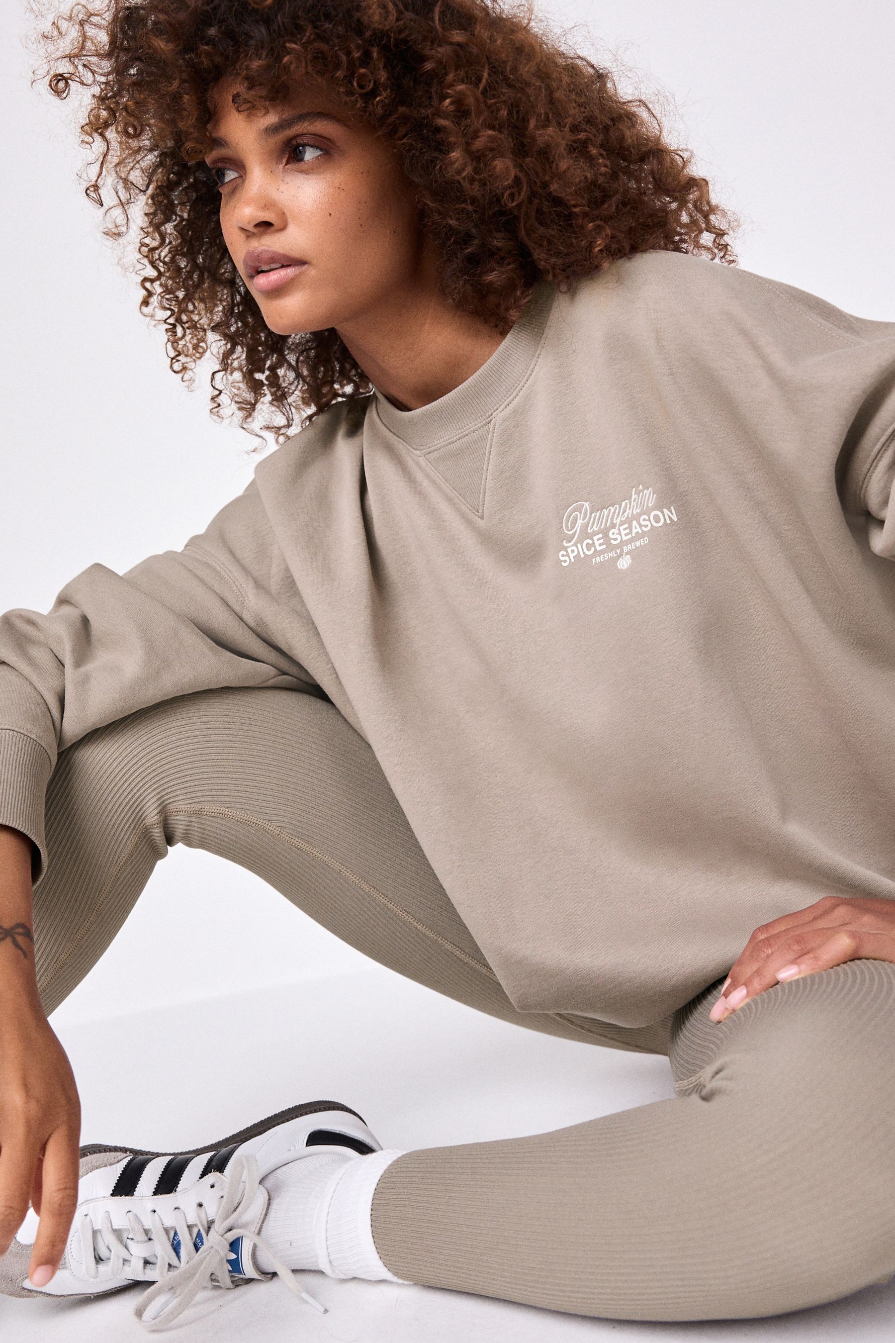Buy Neutral Relaxed Fit Pumpkin Spice Latte Back Graphic Slogan Sweatshirt from the Next UK online shop