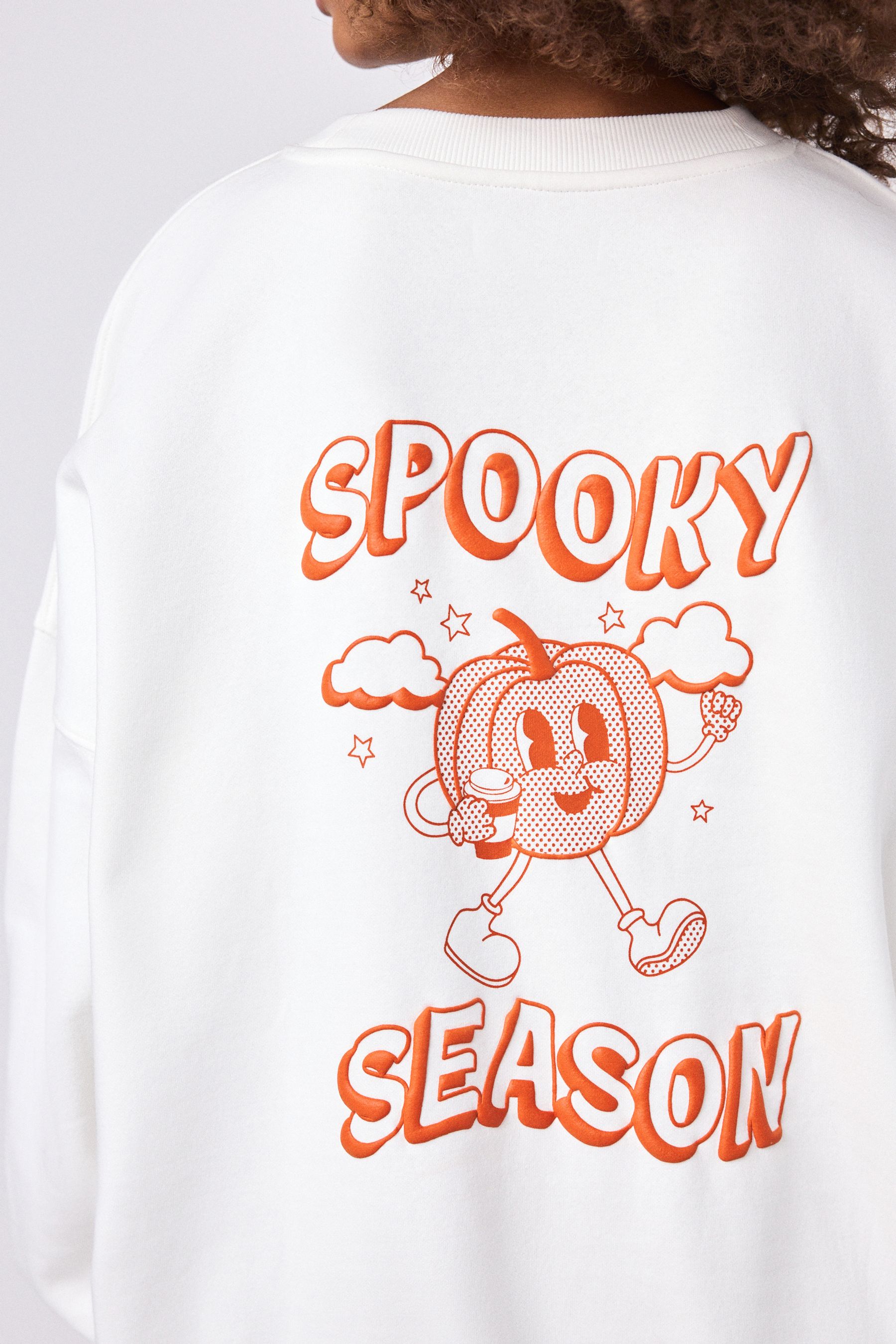 Buy Ecru Orange Graphic Halloween Spooky Season Pumpkin Back Graphic Slogan Sweatshirt from Next Ireland