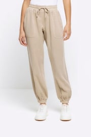 River Island Light Beige Lyocell Jersey Joggers - Image 1 of 5