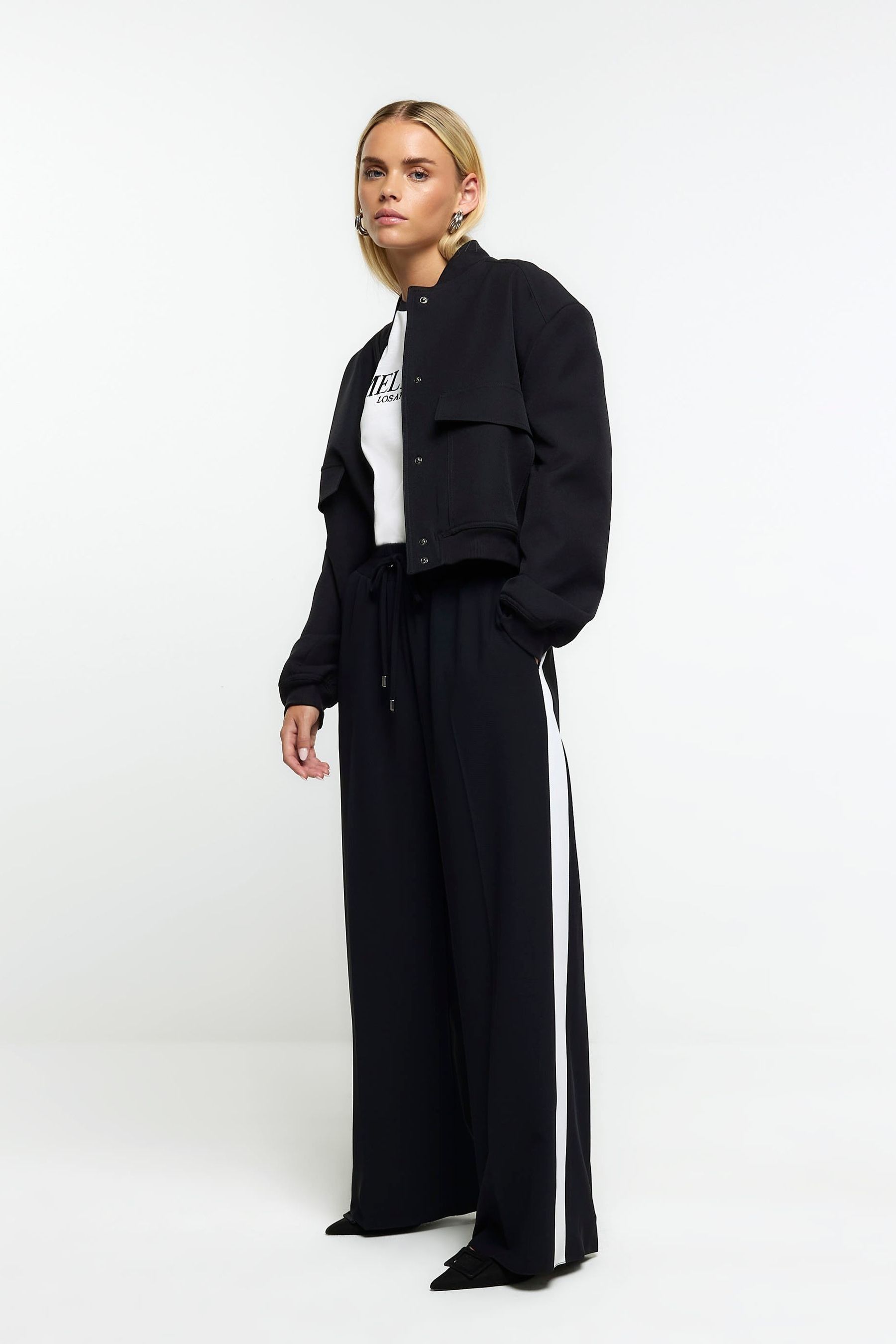 Buy River Island Black Petite Side Stripe Wide Leg Joggers from Next France