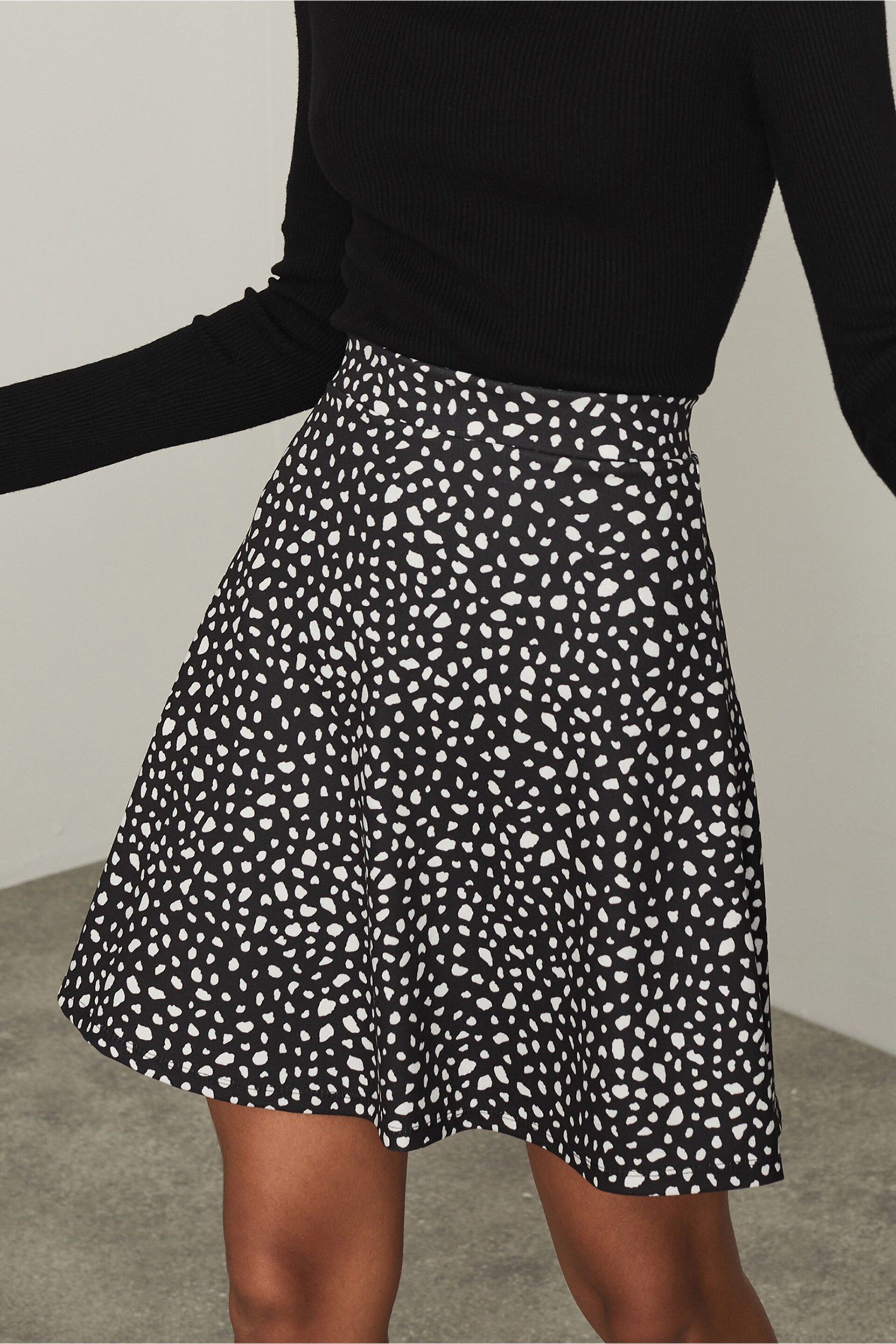 Lipsy Black Non Print Flippy Mini Skater Skirt - Image 1 of 4