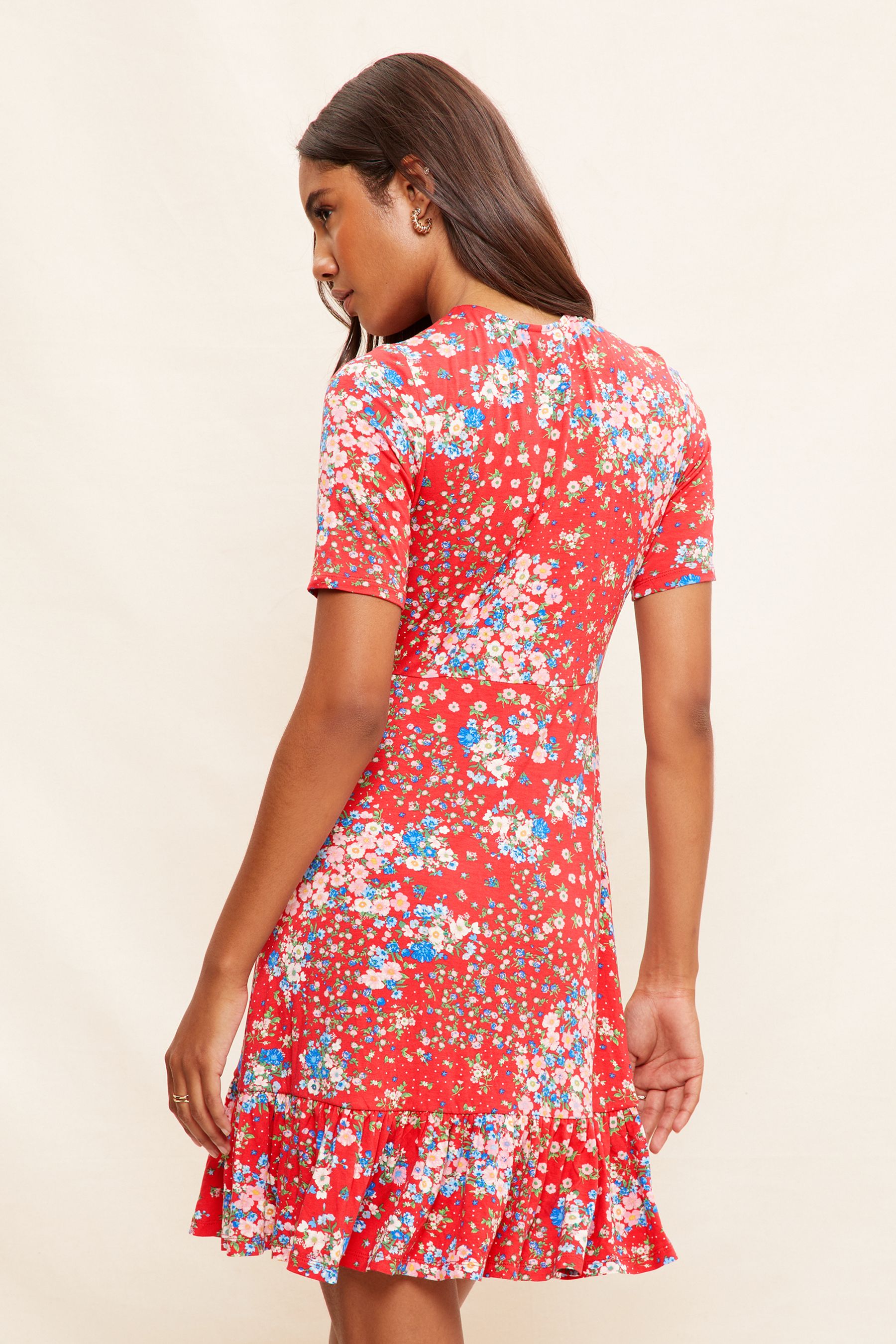 Buy Friends Like These Red Floral Print Short Sleeve Ruffle Hem Jersey Mini Dress from Next Luxembourg