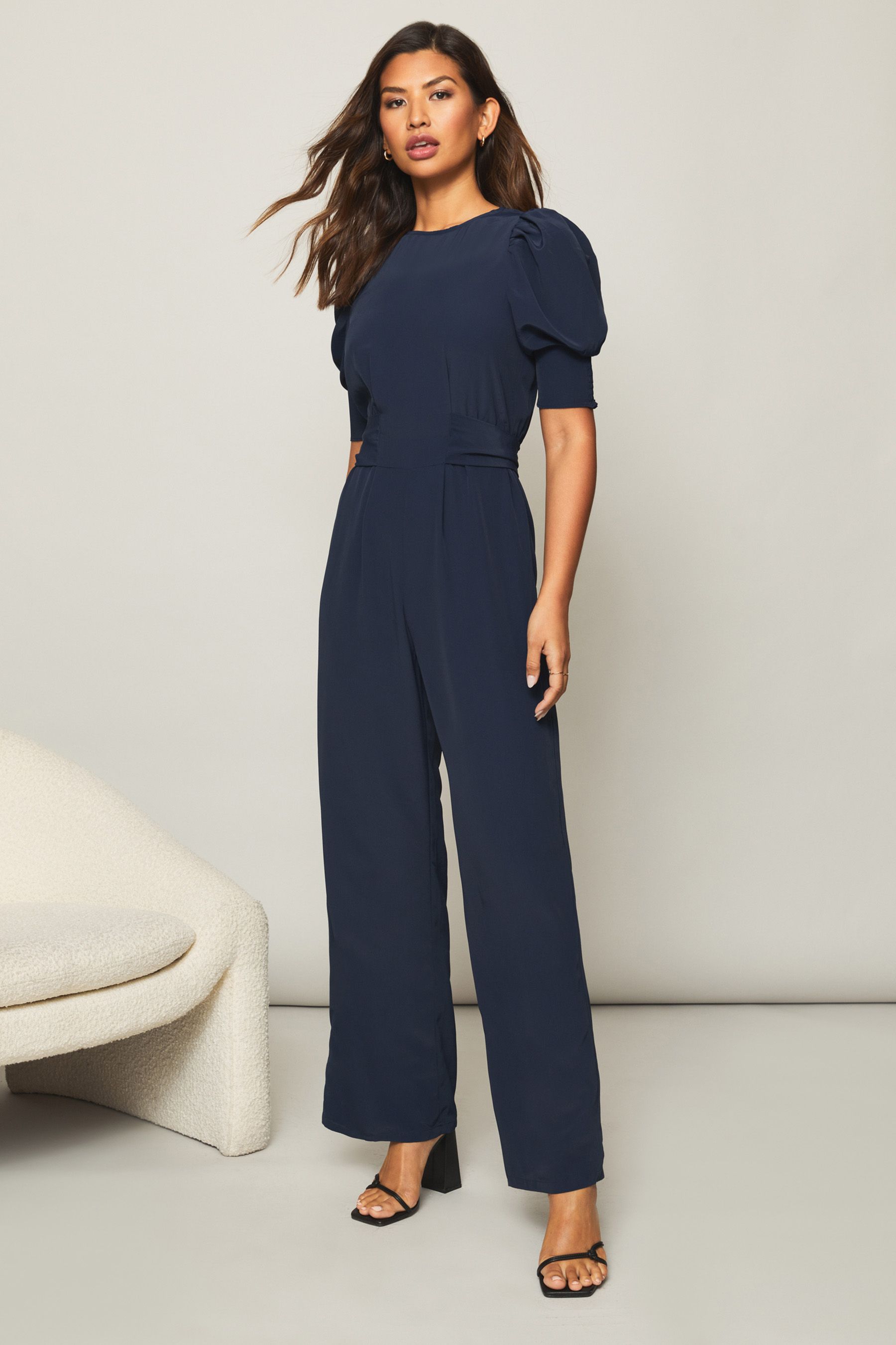 Buy Lipsy Plain Navy Puff Sleeve Tie Waist Summer Jumpsuit from Next Luxembourg