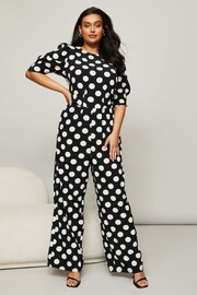 Lipsy Mono Large Spot Curve Puff Sleeve Tie Waist Jumpsuit - Image 1 of 4