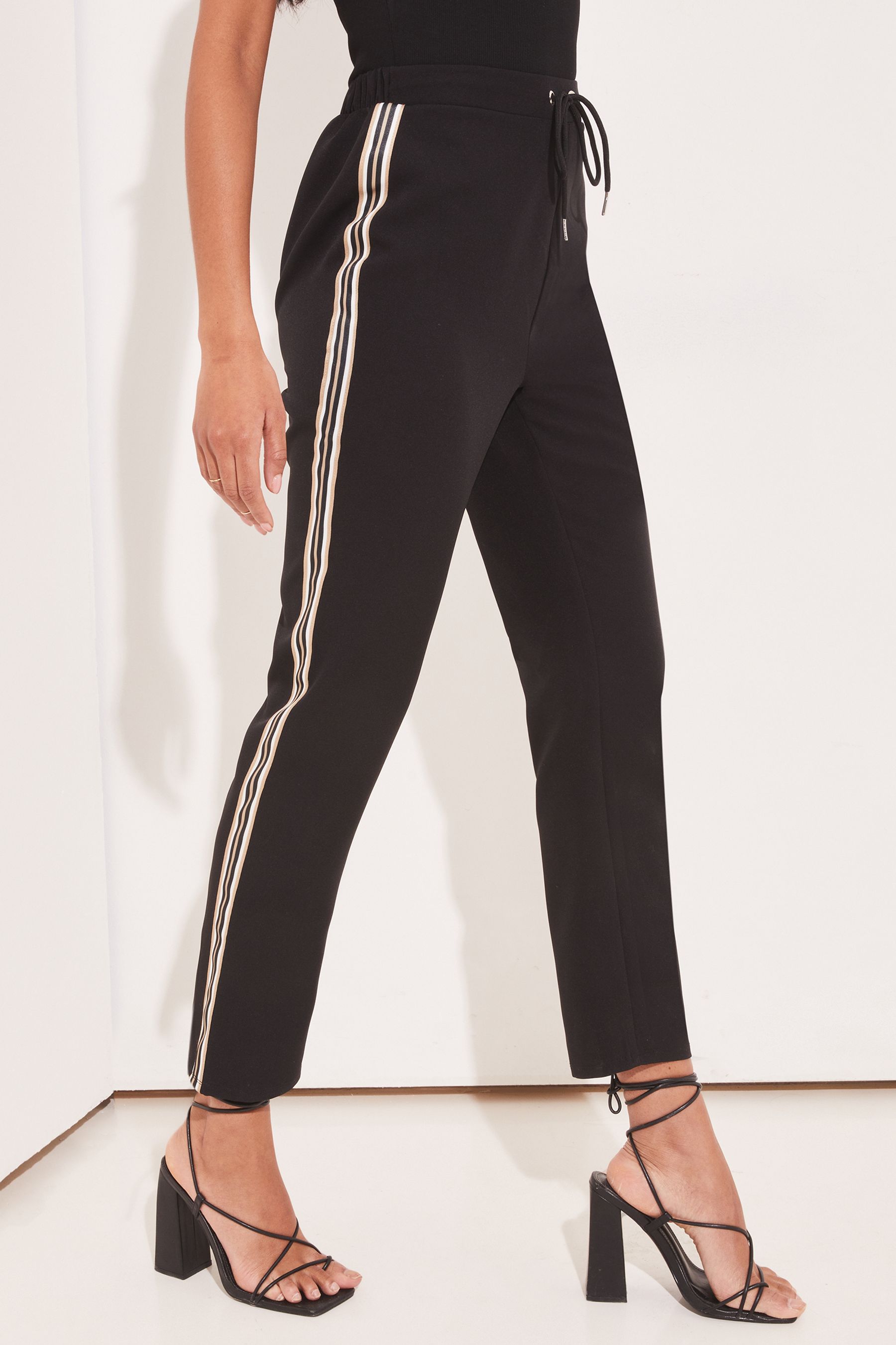 Buy Lipsy Black Side Stripe Side Stripe Tape Joggers from Next Latvia
