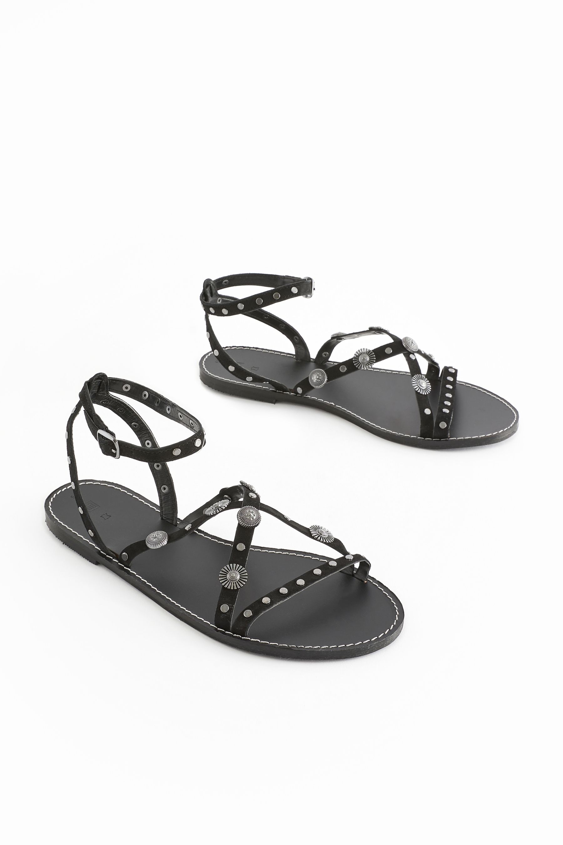 Flat black studded sandals on sale