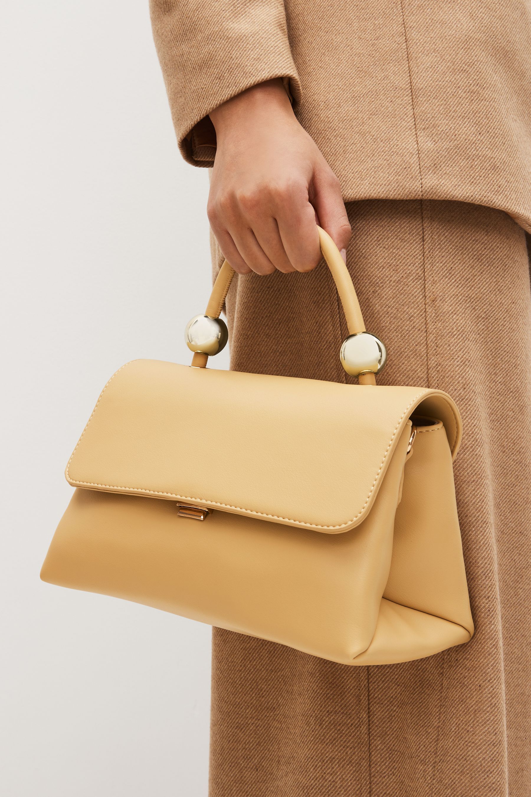 Buy Light Yellow Orb Detail Top Handle Bag from Next Luxembourg