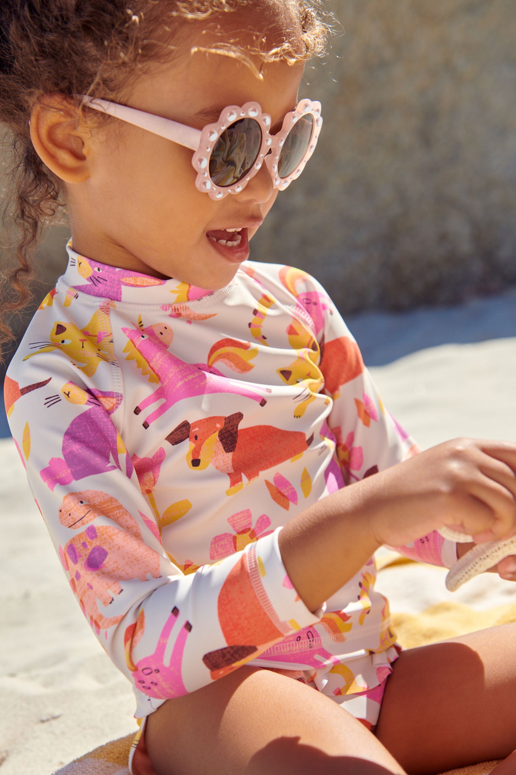 Buy Peach Pink Flower Sunglasses from the Next UK online shop