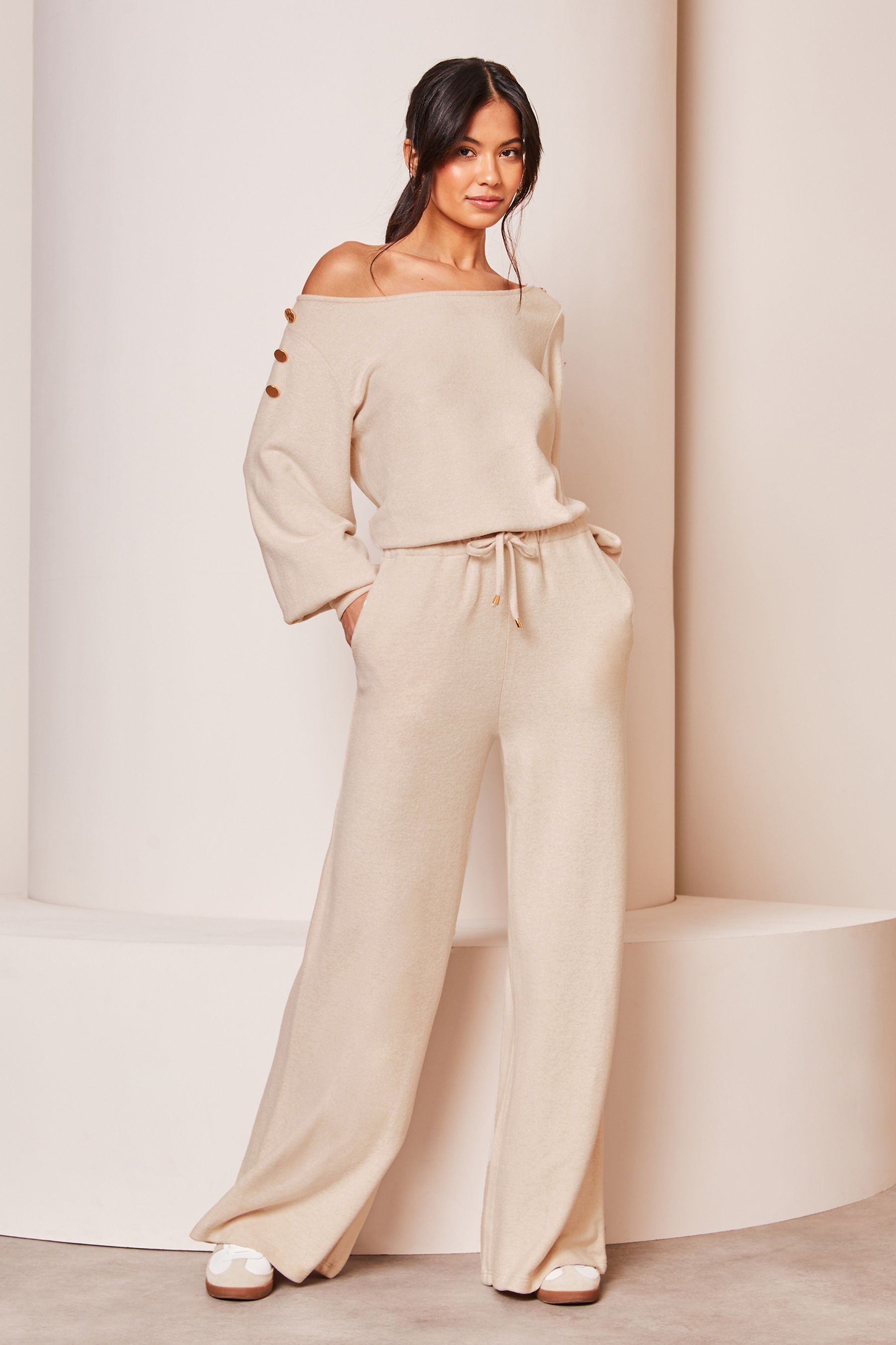 Buy Lipsy Cream Cosy Off The Shoulder Long Sleeve Jumpsuit from Next Ireland