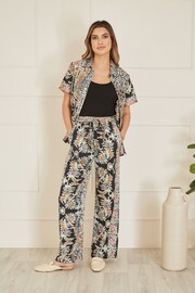 Yumi Black Relaxed Fit Paisley Print Trousers - Image 1 of 4