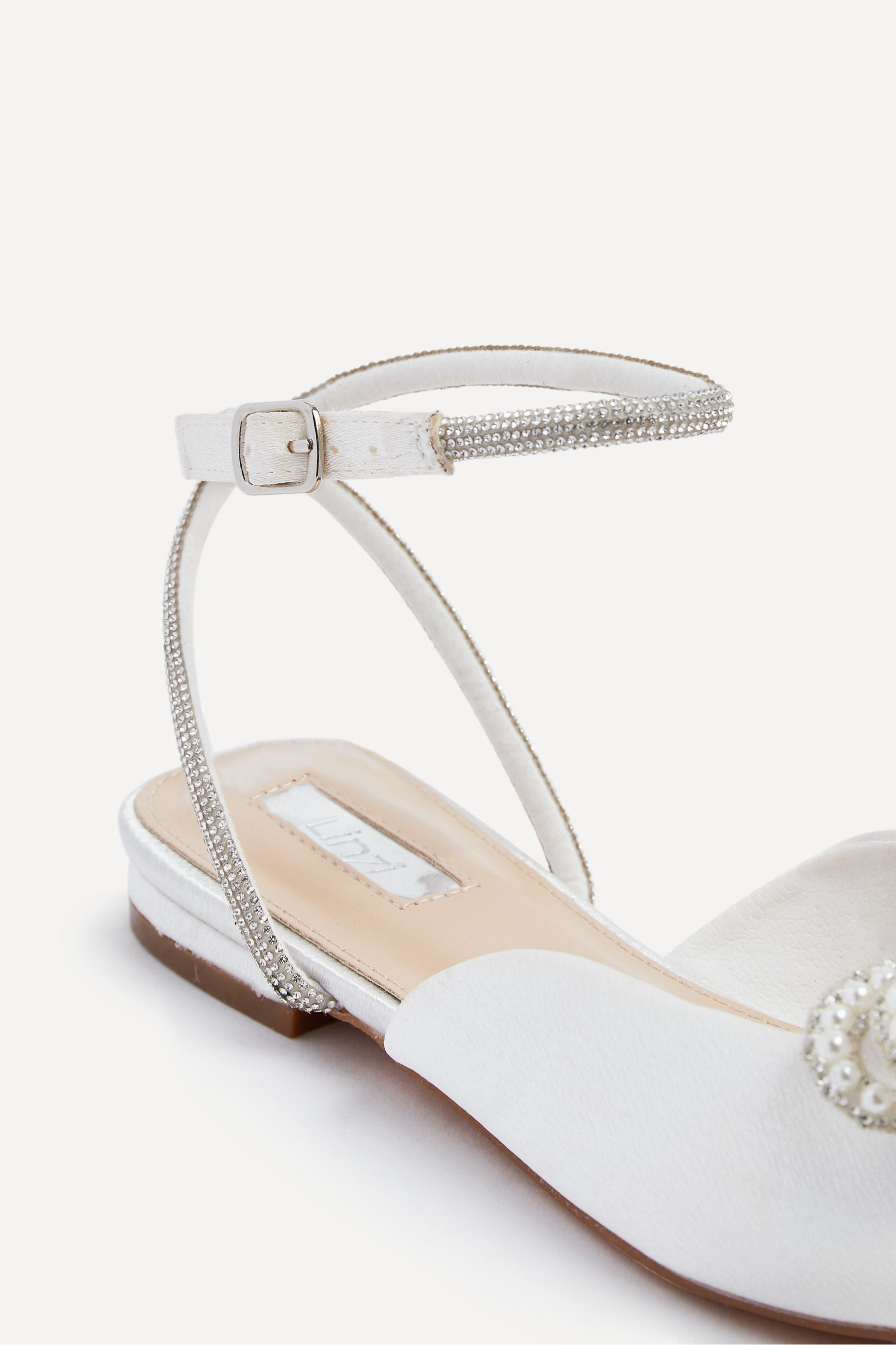 Buy Linzi Cream Lalita Flat Mules With Pearl Embellished Front Bow from Next Canada