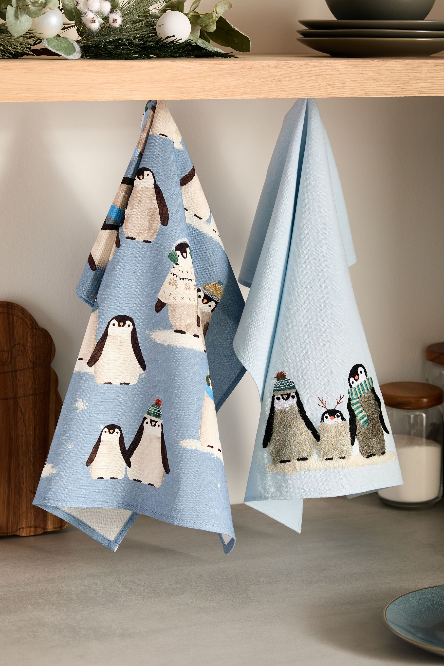 Buy Set of 2 Blue Christmas Penguin 100 Cotton Tea Towels from Next Saudi Arabia