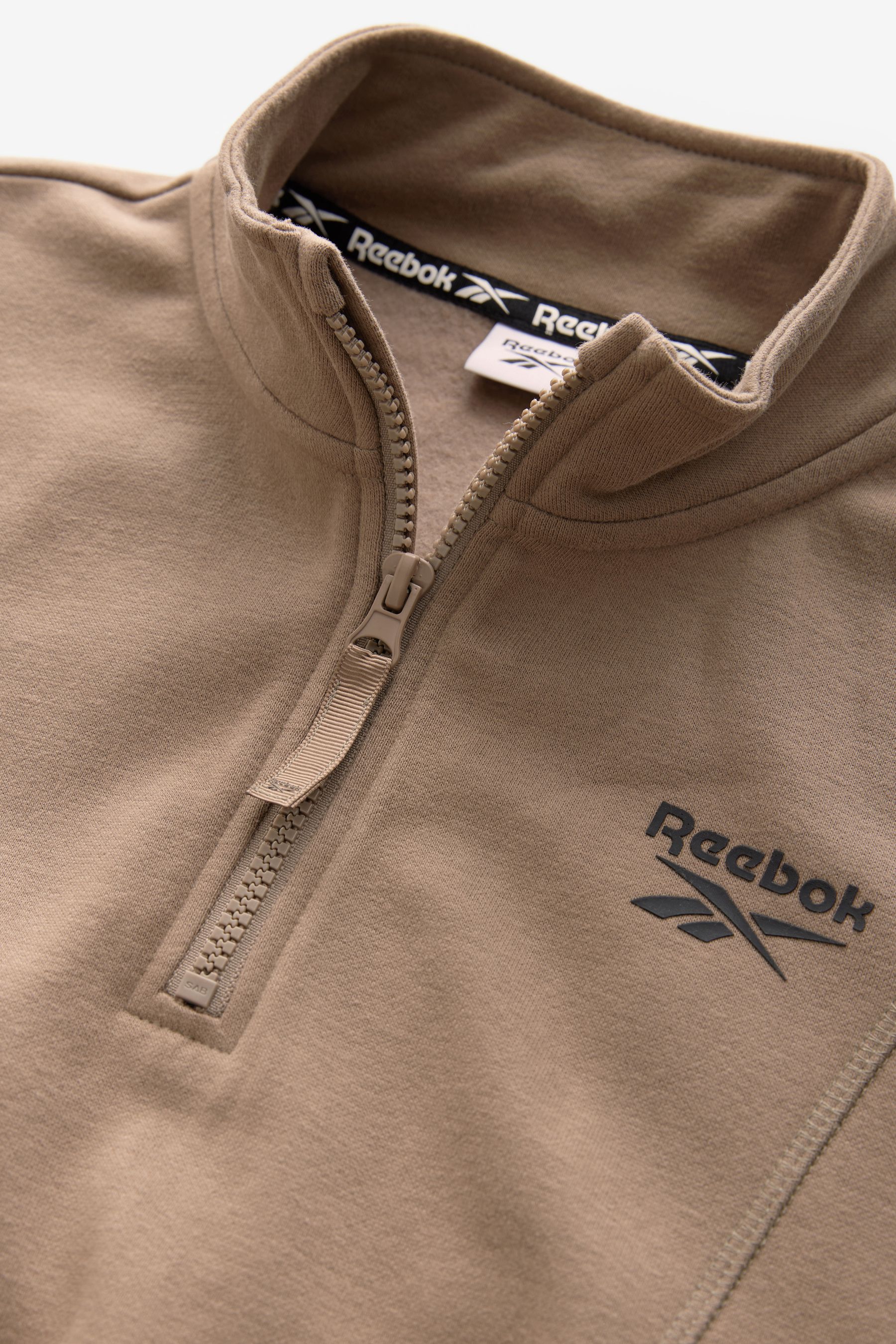 Buy Reebok Girls Cropped Half Zip Brown Sweatshirt from the Next UK online shop