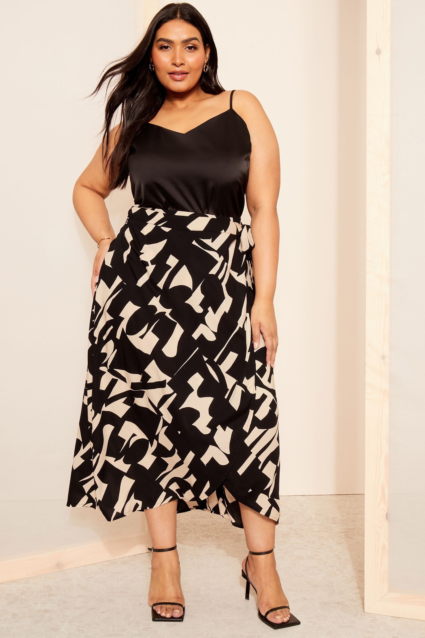 Buy Curves Like These Black Geo Print Wrap Midi Skirt from Next Ireland