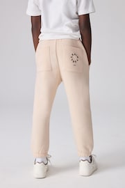 smALLSAINTS Neutral Tierra Straight Cuffed Logo Joggers - Image 4 of 9