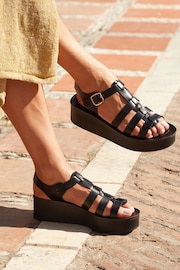 Linzi Black Rhoades Gladiator Inspired Flatform Sandals - Image 1 of 5